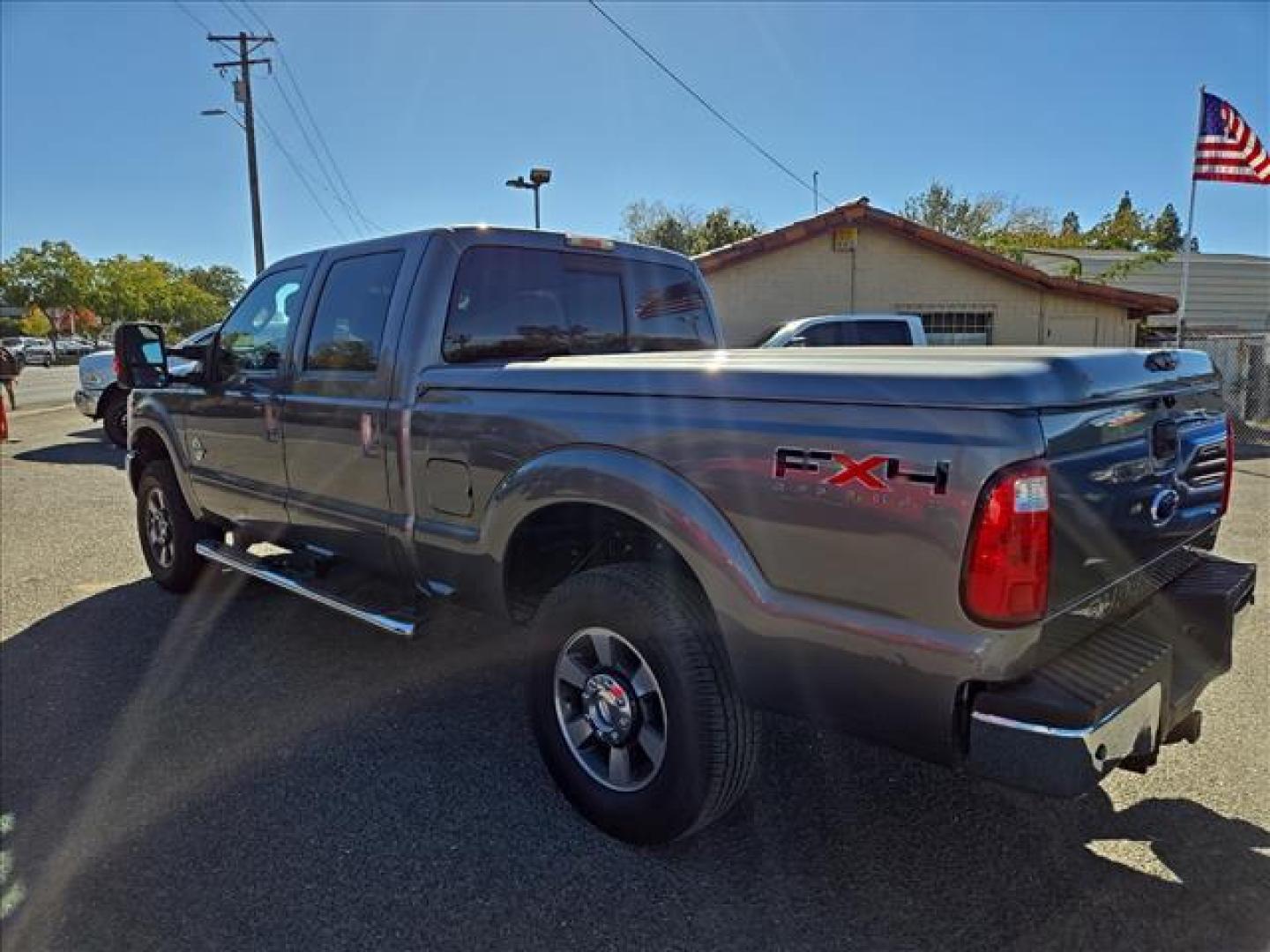 2011 Sterling Grey Metallic Ford F-250 Super Duty Lariat (1FT7W2BT1BE) with an 6.7L Power Stroke 6.7L Biodiesel Turbo V8 400hp 800ft. lbs. Common Rail Direct Injection engine, 6-Speed Shiftable Automatic transmission, located at 800 Riverside Ave, Roseville, CA, 95678, 916-773-4549 & Toll Free: 866-719-4393, 38.732265, -121.291039 - DIESEL CREW CAB 4X4 FX4 LARIAT ONE OWNER LOW MILES - Photo#2