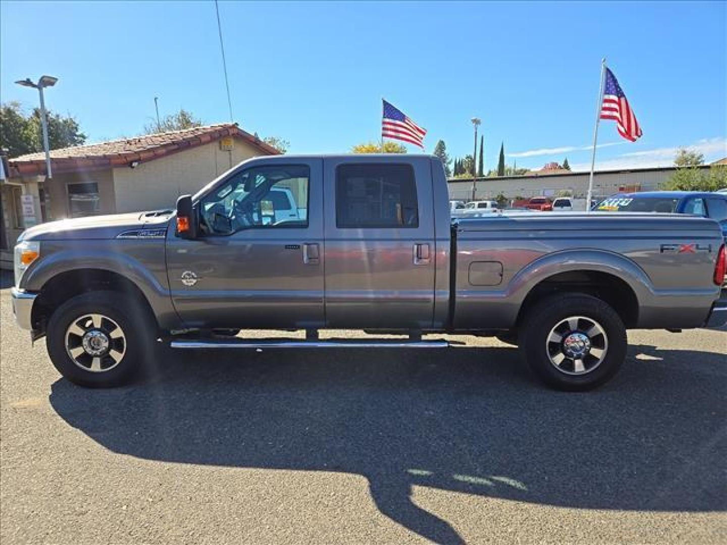 2011 Sterling Grey Metallic Ford F-250 Super Duty Lariat (1FT7W2BT1BE) with an 6.7L Power Stroke 6.7L Biodiesel Turbo V8 400hp 800ft. lbs. Common Rail Direct Injection engine, 6-Speed Shiftable Automatic transmission, located at 800 Riverside Ave, Roseville, CA, 95678, 916-773-4549 & Toll Free: 866-719-4393, 38.732265, -121.291039 - DIESEL CREW CAB 4X4 FX4 LARIAT ONE OWNER LOW MILES - Photo#4