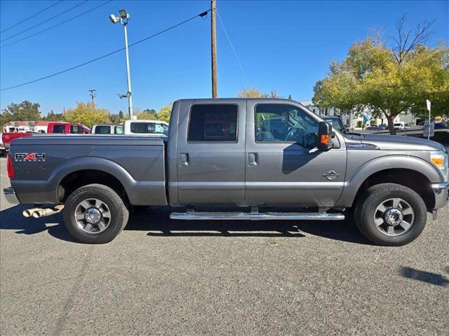 2011 Sterling Grey Metallic Ford F-250 Super Duty Lariat (1FT7W2BT1BE) with an 6.7L Power Stroke 6.7L Biodiesel Turbo V8 400hp 800ft. lbs. Common Rail Direct Injection engine, 6-Speed Shiftable Automatic transmission, located at 800 Riverside Ave, Roseville, CA, 95678, 916-773-4549 & Toll Free: 866-719-4393, 38.732265, -121.291039 - DIESEL CREW CAB 4X4 FX4 LARIAT ONE OWNER LOW MILES - Photo#5