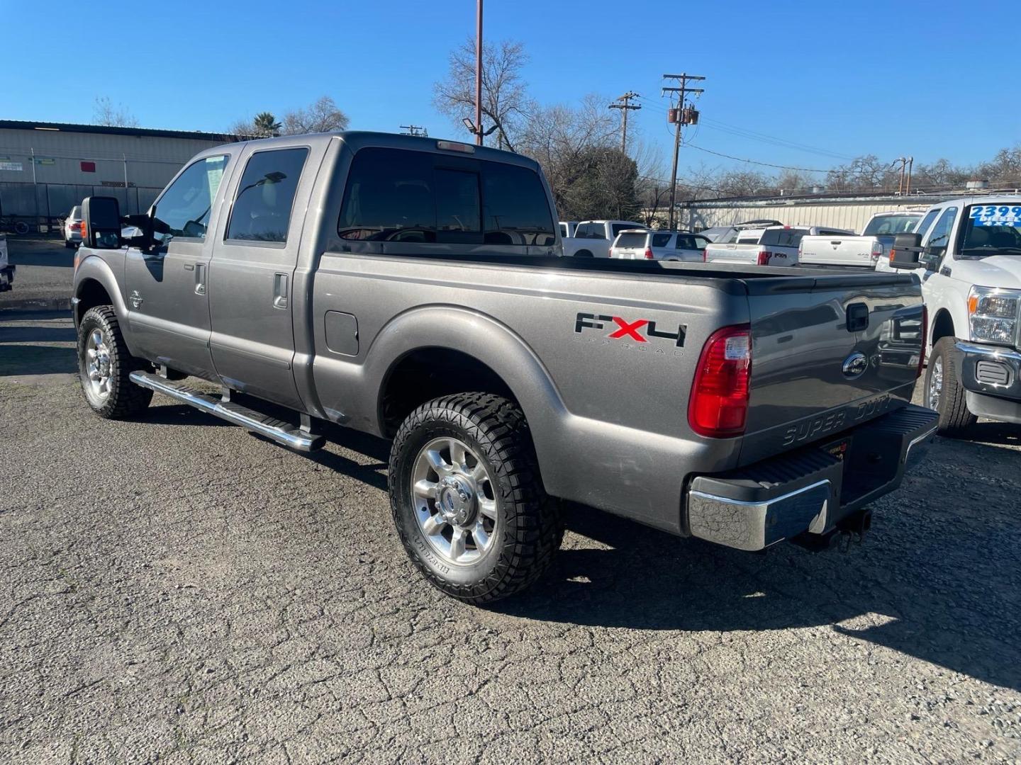 2011 Sterling Grey Metallic Ford F-250 Super Duty Lariat (1FT7W2BT3BE) with an 6.7L Power Stroke 6.7L Biodiesel Turbo V8 400hp 800ft. lbs. Common Rail Direct Injection engine, 6-Speed Shiftable Automatic transmission, located at 800 Riverside Ave, Roseville, CA, 95678, 916-773-4549 & Toll Free: 866-719-4393, 38.732265, -121.291039 - DIESEL CREW CAB 4X4 FX4 NEW TIRES SERVICE RECORDS - Photo#2