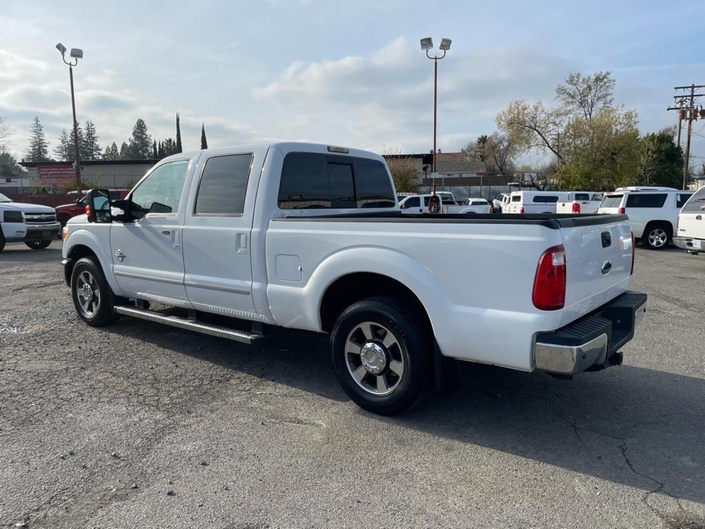 2011 Oxford White Ford F-250 Super Duty Lariat (1FT7W2AT2BE) with an 6.7L Power Stroke 6.7L Biodiesel Turbo V8 400hp 800ft. lbs. Common Rail Direct Injection engine, 6-Speed Shiftable Automatic transmission, located at 800 Riverside Ave, Roseville, CA, 95678, 916-773-4549 & Toll Free: 866-719-4393, 38.732265, -121.291039 - DIESEL CREW CAB LARIAT LOW MILES - Photo#2