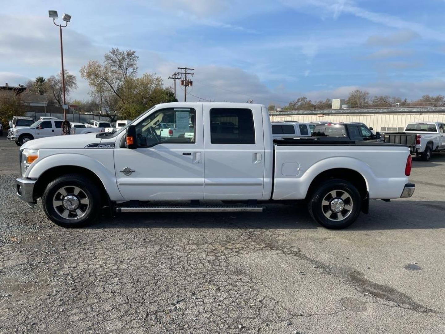 2011 Oxford White Ford F-250 Super Duty Lariat (1FT7W2AT2BE) with an 6.7L Power Stroke 6.7L Biodiesel Turbo V8 400hp 800ft. lbs. Common Rail Direct Injection engine, 6-Speed Shiftable Automatic transmission, located at 800 Riverside Ave, Roseville, CA, 95678, 916-773-4549 & Toll Free: 866-719-4393, 38.732265, -121.291039 - DIESEL CREW CAB LARIAT LOW MILES - Photo#4