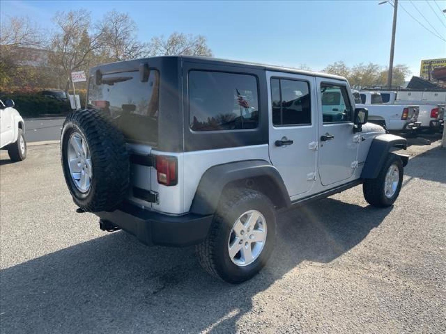 2011 Bright Silver Metallic Clear Coat Jeep Wrangler Unlimited Rubicon (1J4BA6H18BL) with an 3.8L 3.8L V6 202hp 237ft. lbs. Sequential Multiport Fuel Injection engine, 4-Speed Automatic transmission, located at 800 Riverside Ave, Roseville, CA, 95678, 916-773-4549 & Toll Free: 866-719-4393, 38.732265, -121.291039 - 4X4 UNLIMITED RUBICON HARD TOP - Photo#4
