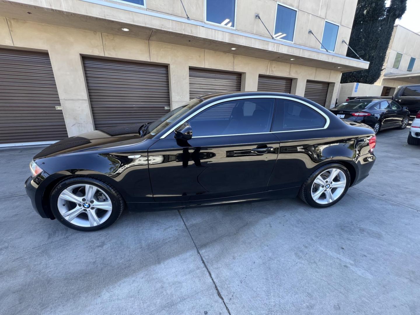2012 BLACK /Black BMW 1-Series 128i Coupe (WBAUP9C59CV) with an 3.0L L6 DOHC 24V engine, Automatic transmission, located at 30 S. Berkeley Avenue, Pasadena, CA, 91107, (626) 248-7567, 34.145447, -118.109398 - Discover the sleek and stylish 2012 BMW 128 at Crown City Motors, located at 30 S Berkeley Ave, Pasadena, CA 91107. As a premier buy here pay here dealer in Pasadena, we’re proud to offer this luxury compact coupe with low mileage and top-tier performance. The 2012 BMW 128 combines a powerful engi - Photo#11