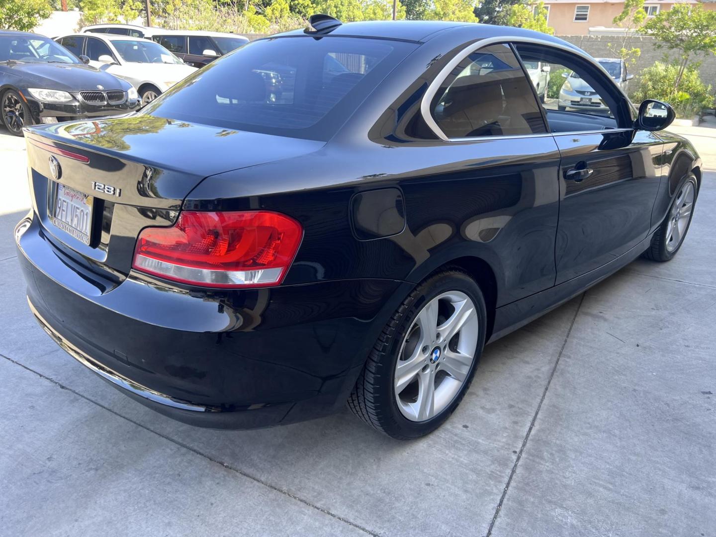 2012 BLACK /Black BMW 1-Series 128i Coupe (WBAUP9C59CV) with an 3.0L L6 DOHC 24V engine, Automatic transmission, located at 30 S. Berkeley Avenue, Pasadena, CA, 91107, (626) 248-7567, 34.145447, -118.109398 - Discover the sleek and stylish 2012 BMW 128 at Crown City Motors, located at 30 S Berkeley Ave, Pasadena, CA 91107. As a premier buy here pay here dealer in Pasadena, we’re proud to offer this luxury compact coupe with low mileage and top-tier performance. The 2012 BMW 128 combines a powerful engi - Photo#12
