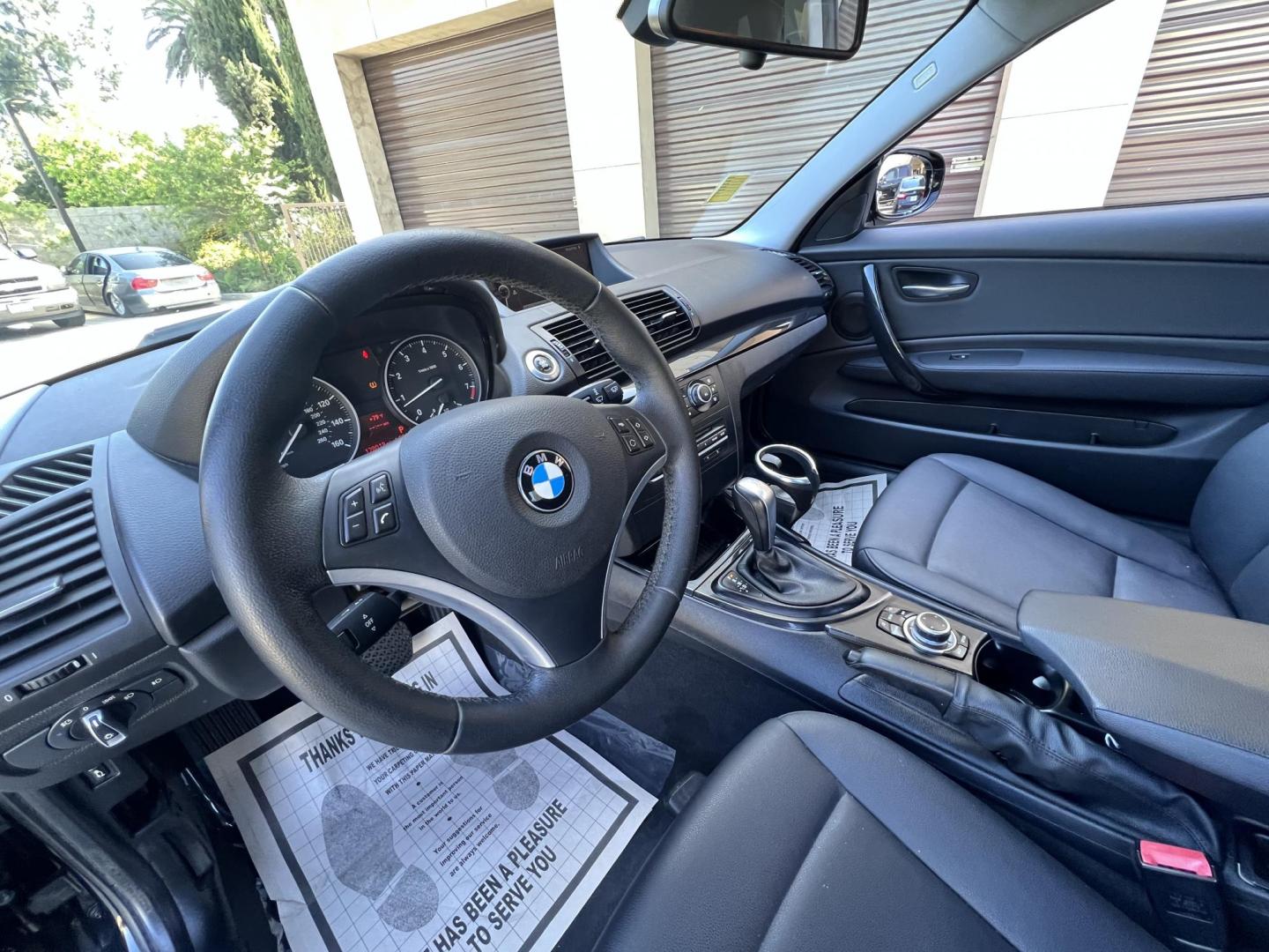 2012 BLACK /Black BMW 1-Series 128i Coupe (WBAUP9C59CV) with an 3.0L L6 DOHC 24V engine, Automatic transmission, located at 30 S. Berkeley Avenue, Pasadena, CA, 91107, (626) 248-7567, 34.145447, -118.109398 - Discover the sleek and stylish 2012 BMW 128 at Crown City Motors, located at 30 S Berkeley Ave, Pasadena, CA 91107. As a premier buy here pay here dealer in Pasadena, we’re proud to offer this luxury compact coupe with low mileage and top-tier performance. The 2012 BMW 128 combines a powerful engi - Photo#25