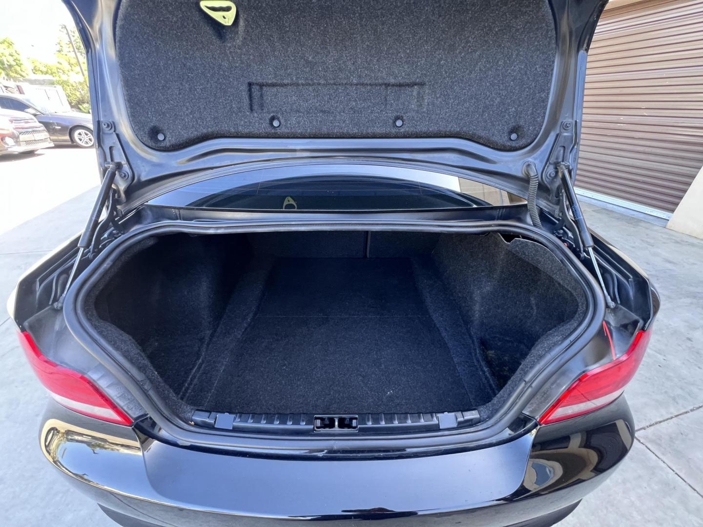 2012 BLACK /Black BMW 1-Series 128i Coupe (WBAUP9C59CV) with an 3.0L L6 DOHC 24V engine, Automatic transmission, located at 30 S. Berkeley Avenue, Pasadena, CA, 91107, (626) 248-7567, 34.145447, -118.109398 - Discover the sleek and stylish 2012 BMW 128 at Crown City Motors, located at 30 S Berkeley Ave, Pasadena, CA 91107. As a premier buy here pay here dealer in Pasadena, we’re proud to offer this luxury compact coupe with low mileage and top-tier performance. The 2012 BMW 128 combines a powerful engi - Photo#35