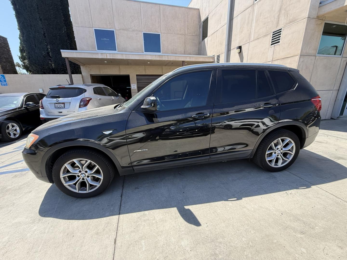 2012 Black /black BMW X3 xDrive28i (5UXWX5C54CL) with an 3.0L L6 DOHC 24V engine, 8-Speed Automatic transmission, located at 30 S. Berkeley Avenue, Pasadena, CA, 91107, (626) 248-7567, 34.145447, -118.109398 - Crown City Motors is a used “Buy Here Pay Here” car dealer in Pasadena CA. “Buy Here Pay Here” financing, means that when you purchase your vehicle from our dealership, that you make the payments to the dealership as well. We do not need the banks approval to get you approved for a used auto- Photo#1
