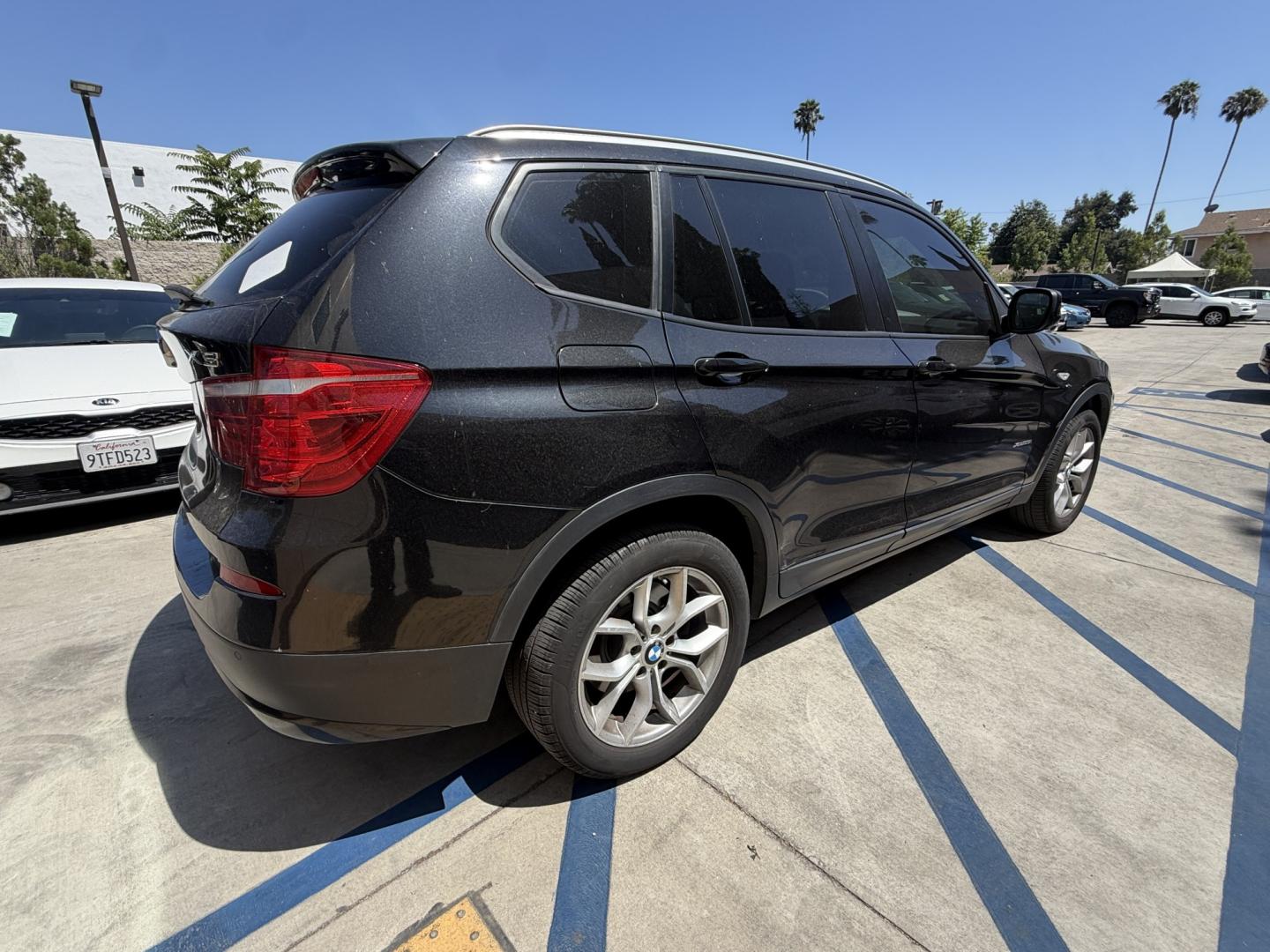 2012 Black /black BMW X3 xDrive28i (5UXWX5C54CL) with an 3.0L L6 DOHC 24V engine, 8-Speed Automatic transmission, located at 30 S. Berkeley Avenue, Pasadena, CA, 91107, (626) 248-7567, 34.145447, -118.109398 - Crown City Motors is a used “Buy Here Pay Here” car dealer in Pasadena CA. “Buy Here Pay Here” financing, means that when you purchase your vehicle from our dealership, that you make the payments to the dealership as well. We do not need the banks approval to get you approved for a used auto- Photo#4