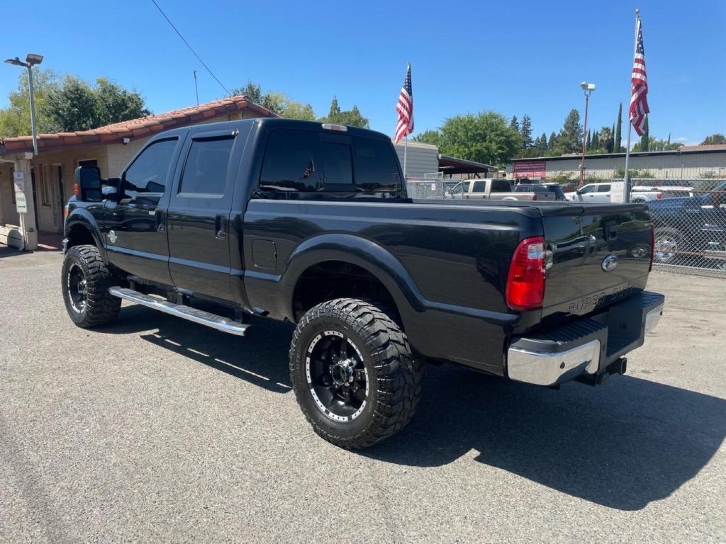 2012 Black Ford F-250 Super Duty Lariat (1FT7W2BT3CE) with an 6.7L Power Stroke 6.7L Biodiesel Turbo V8 400hp 800ft. lbs. Common Rail Direct Injection engine, 6-Speed Shiftable Automatic transmission, located at 800 Riverside Ave, Roseville, CA, 95678, 916-773-4549 & Toll Free: 866-719-4393, 38.732265, -121.291039 - DIESEL CREW CAB 4X4 LARIAT LIFTED CLEAN CARFAX - Photo#2
