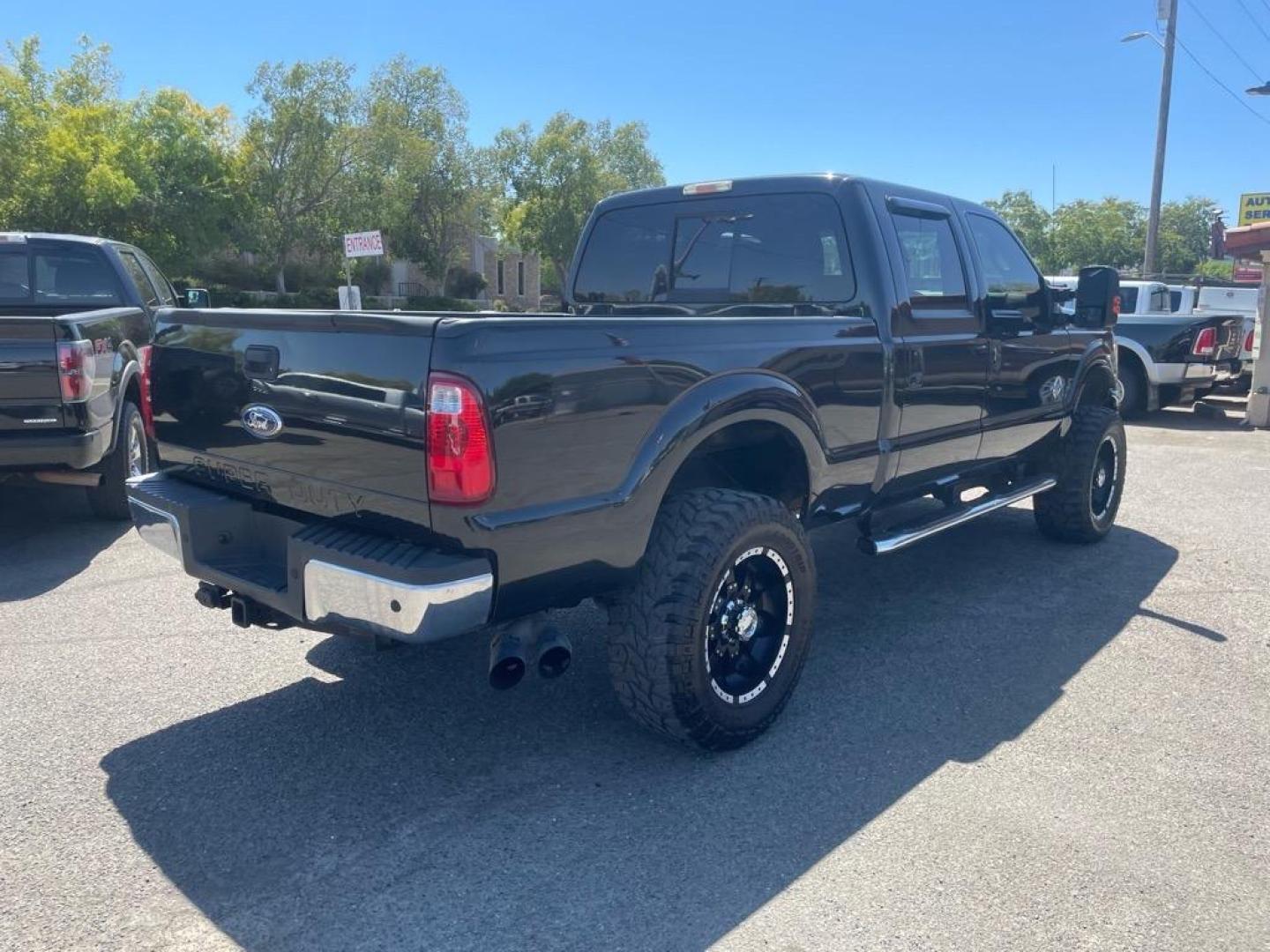 2012 Black Ford F-250 Super Duty Lariat (1FT7W2BT3CE) with an 6.7L Power Stroke 6.7L Biodiesel Turbo V8 400hp 800ft. lbs. Common Rail Direct Injection engine, 6-Speed Shiftable Automatic transmission, located at 800 Riverside Ave, Roseville, CA, 95678, 916-773-4549 & Toll Free: 866-719-4393, 38.732265, -121.291039 - DIESEL CREW CAB 4X4 LARIAT LIFTED CLEAN CARFAX - Photo#3