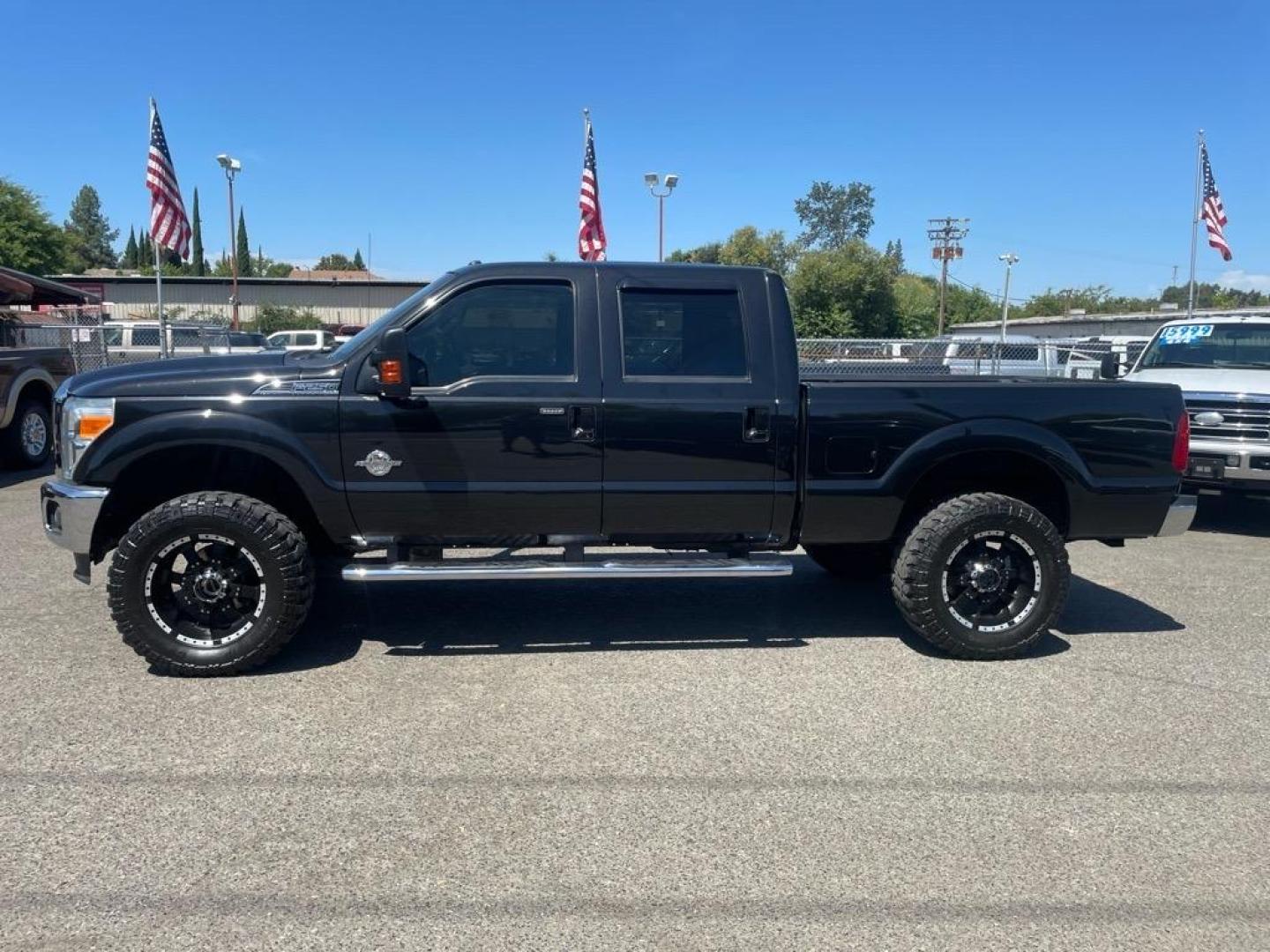 2012 Black Ford F-250 Super Duty Lariat (1FT7W2BT3CE) with an 6.7L Power Stroke 6.7L Biodiesel Turbo V8 400hp 800ft. lbs. Common Rail Direct Injection engine, 6-Speed Shiftable Automatic transmission, located at 800 Riverside Ave, Roseville, CA, 95678, 916-773-4549 & Toll Free: 866-719-4393, 38.732265, -121.291039 - DIESEL CREW CAB 4X4 LARIAT LIFTED CLEAN CARFAX - Photo#4