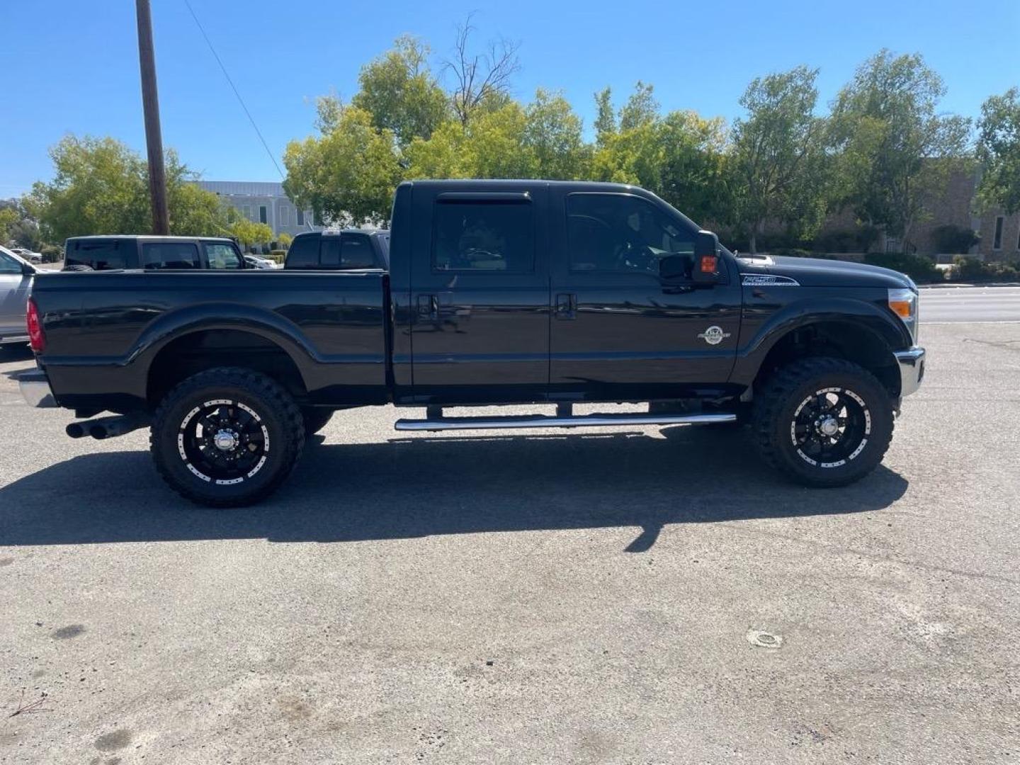 2012 Black Ford F-250 Super Duty Lariat (1FT7W2BT3CE) with an 6.7L Power Stroke 6.7L Biodiesel Turbo V8 400hp 800ft. lbs. Common Rail Direct Injection engine, 6-Speed Shiftable Automatic transmission, located at 800 Riverside Ave, Roseville, CA, 95678, 916-773-4549 & Toll Free: 866-719-4393, 38.732265, -121.291039 - DIESEL CREW CAB 4X4 LARIAT LIFTED CLEAN CARFAX - Photo#5