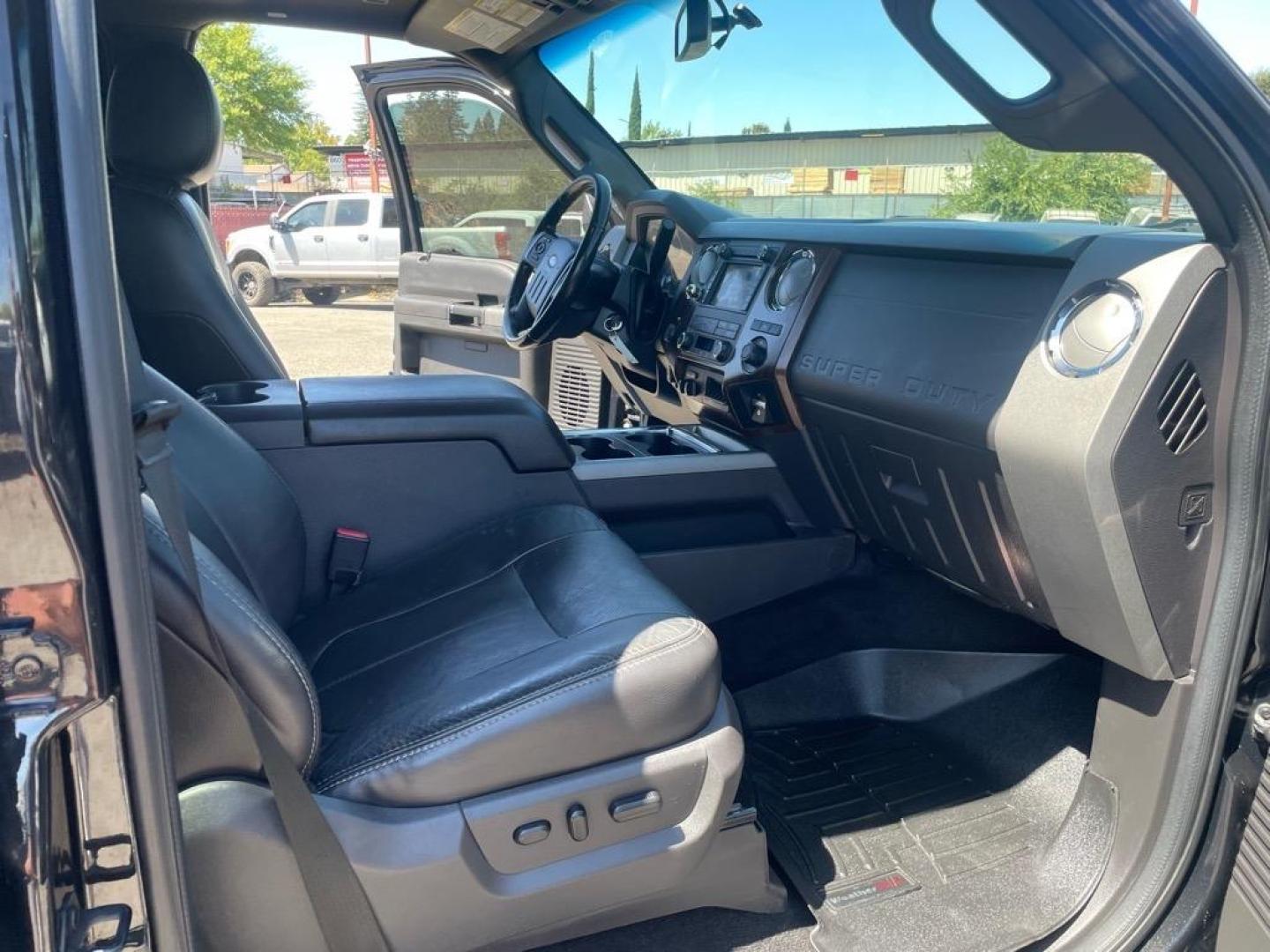 2012 Black Ford F-250 Super Duty Lariat (1FT7W2BT3CE) with an 6.7L Power Stroke 6.7L Biodiesel Turbo V8 400hp 800ft. lbs. Common Rail Direct Injection engine, 6-Speed Shiftable Automatic transmission, located at 800 Riverside Ave, Roseville, CA, 95678, 916-773-4549 & Toll Free: 866-719-4393, 38.732265, -121.291039 - DIESEL CREW CAB 4X4 LARIAT LIFTED CLEAN CARFAX - Photo#11