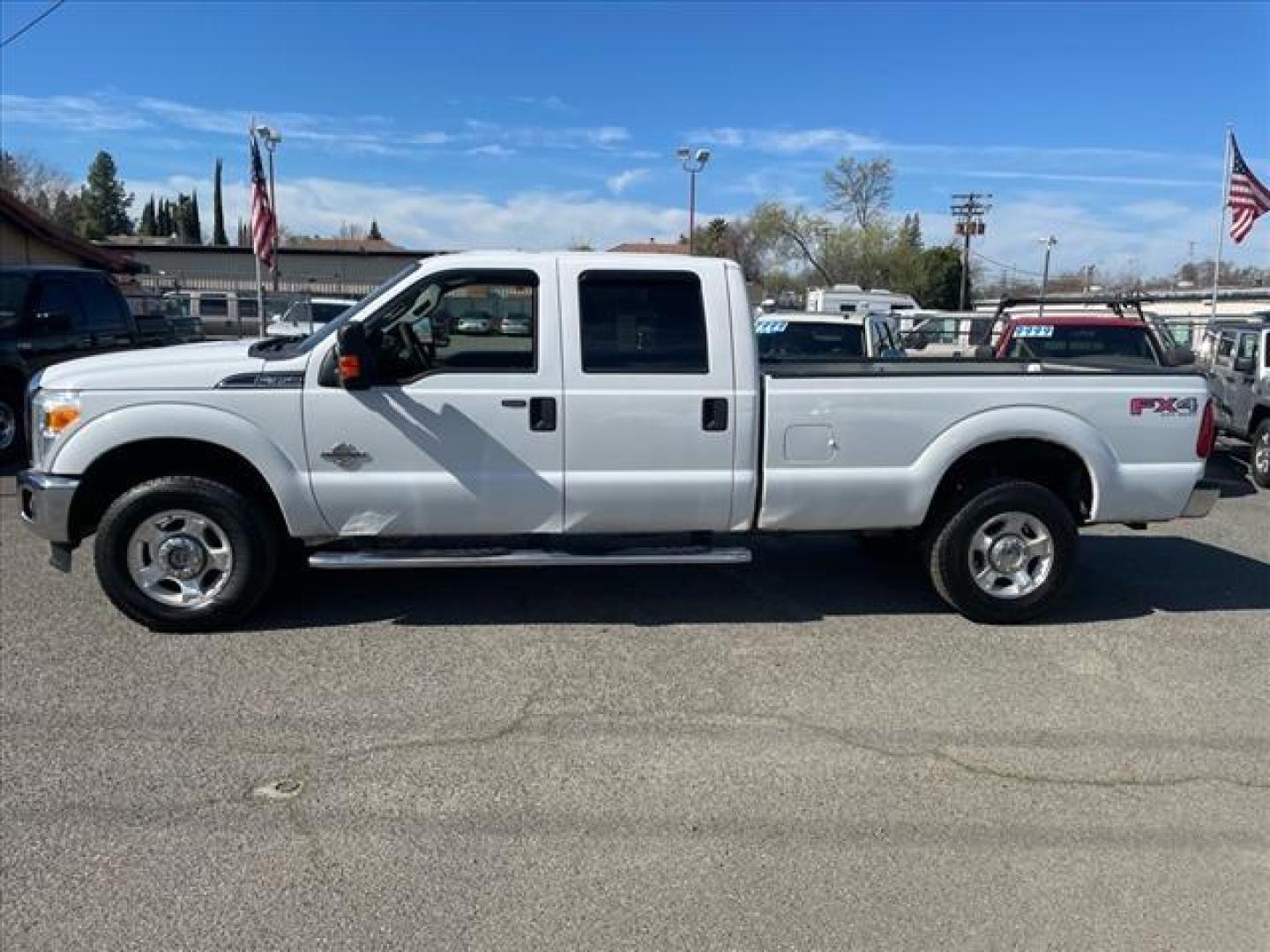 2012 Oxford White Ford F-350 Super Duty XLT (1FT8W3BTXCE) with an 6.7L Power Stroke 6.7L Biodiesel Turbo V8 400hp 800ft. lbs. Common Rail Direct Injection engine, 6-Speed Shiftable Automatic transmission, located at 800 Riverside Ave, Roseville, CA, 95678, 916-773-4549 & Toll Free: 866-719-4393, 38.732265, -121.291039 - DIESEL CREW CAB 4X4 FX4 XLT SERVICE RECORDS ON CLEAN CARFAX - Photo#4