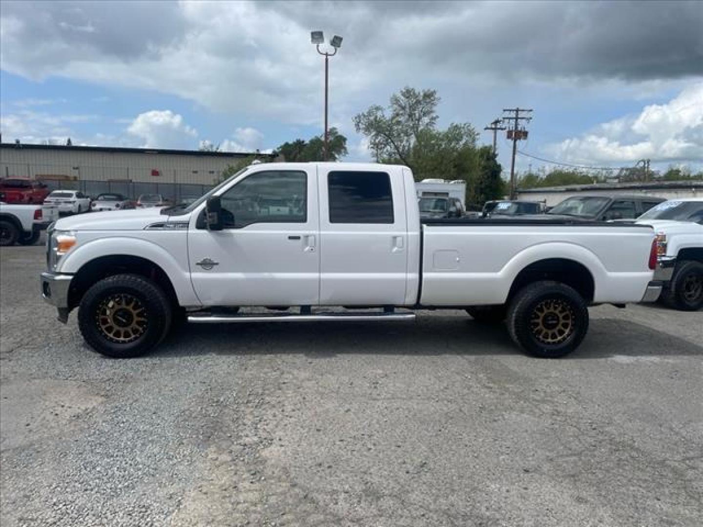 2012 Oxford White Ford F-350 Super Duty Lariat (1FT8W3BT1CE) with an 6.7L Power Stroke 6.7L Biodiesel Turbo V8 400hp 800ft. lbs. Common Rail Direct Injection engine, 6-Speed Shiftable Automatic transmission, located at 800 Riverside Ave, Roseville, CA, 95678, 916-773-4549 & Toll Free: 866-719-4393, 38.732265, -121.291039 - DIESEL CREW CAB 4X4 LARIAT MOON ROOF CLEAN CARFAX - Photo#1