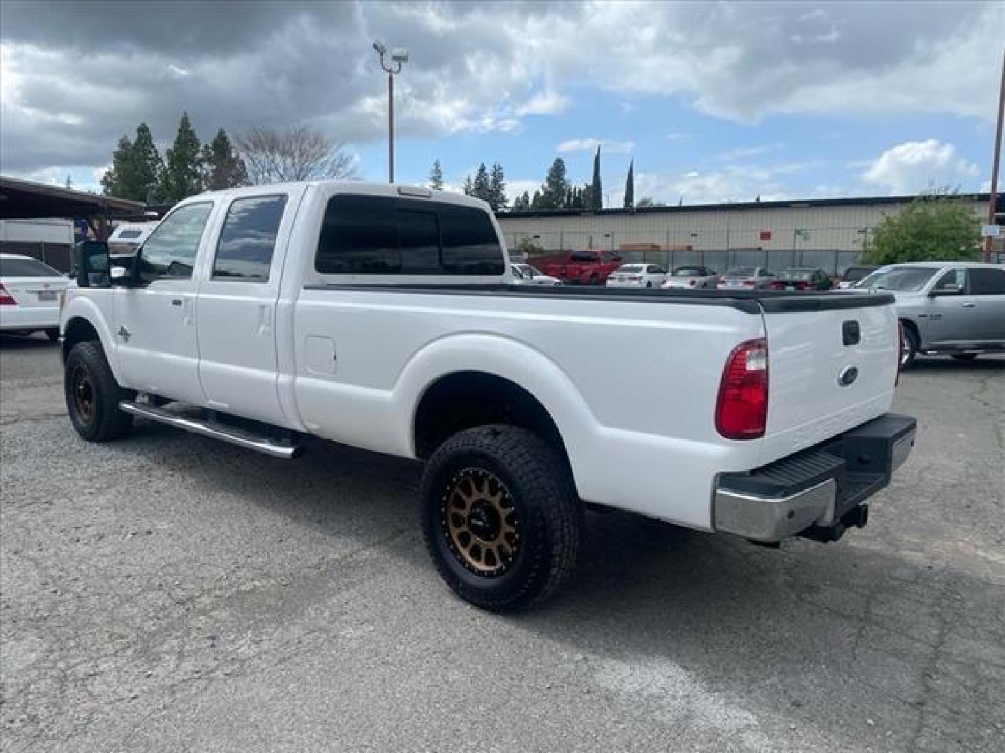 2012 Oxford White Ford F-350 Super Duty Lariat (1FT8W3BT1CE) with an 6.7L Power Stroke 6.7L Biodiesel Turbo V8 400hp 800ft. lbs. Common Rail Direct Injection engine, 6-Speed Shiftable Automatic transmission, located at 800 Riverside Ave, Roseville, CA, 95678, 916-773-4549 & Toll Free: 866-719-4393, 38.732265, -121.291039 - DIESEL CREW CAB 4X4 LARIAT MOON ROOF CLEAN CARFAX - Photo#2