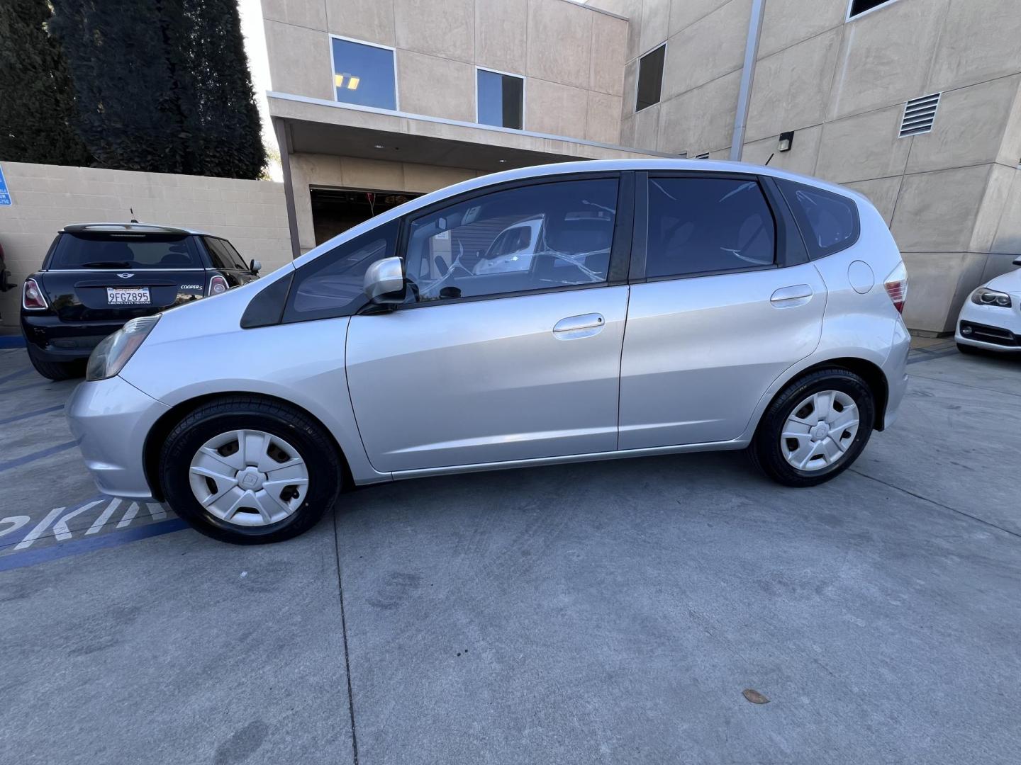2012 Silver /Black Honda Fit 5-Speed AT (JHMGE8H30CC) with an 1.5L L4 SOHC 16V engine, 5-Speed Automatic transmission, located at 30 S. Berkeley Avenue, Pasadena, CA, 91107, (626) 248-7567, 34.145447, -118.109398 - Reliable 2012 Honda Fit – Automatic – Buy Here Pay Here – Silver – Bad Credit OK! Looking for a fuel-efficient hatchback with Honda reliability and flexible financing? This 2012 Honda Fit with Automatic Transmission in Silver is the perfect solution. Available now at Crown City Motors in - Photo#3