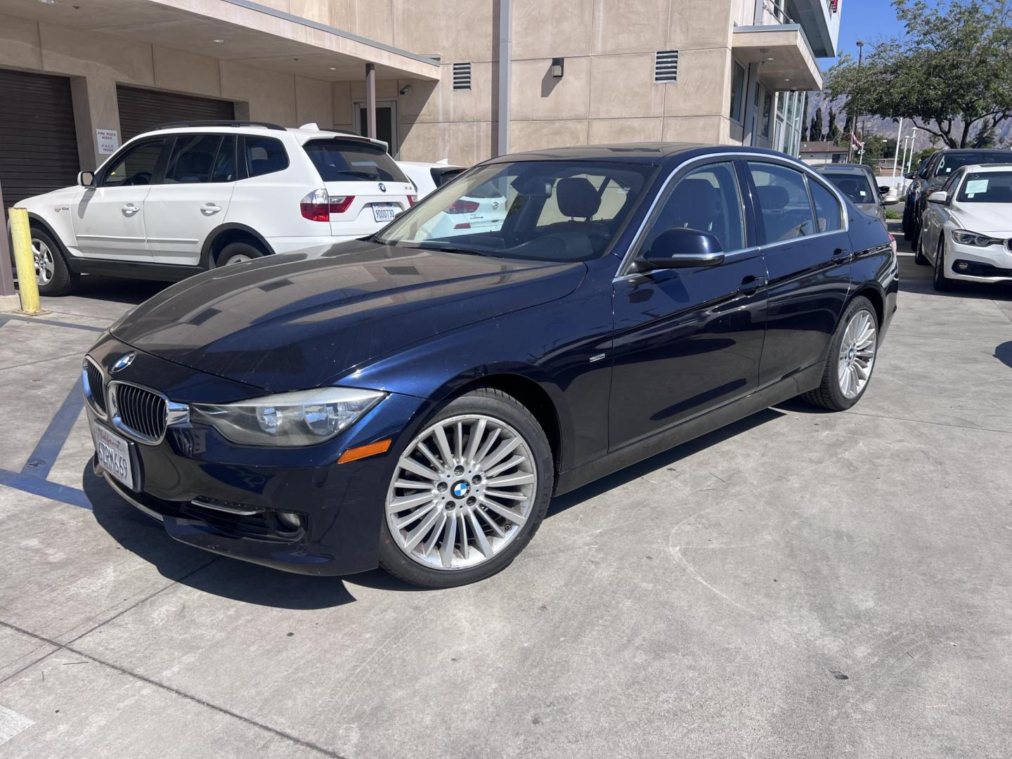2013 Imperial Blue Metallic /Saddle Brown (Dakota Leather) BMW 3-Series 328i Sedan - SULEV (WBA3C1G51DN) with an 2.0L L4 DOHC 16V engine, Automatic transmission, located at 30 S. Berkeley Avenue, Pasadena, CA, 91107, (626) 248-7567, 34.145447, -118.109398 - 2013 BMW 3 Series Sedan – Buy Here Pay Here Pasadena, CA VIN: WBA3C1G51DNR44018 If you’re looking for a sporty, premium sedan that’s comfortable, efficient, and fun to drive, this 2013 BMW 3 Series is the sweet spot. Available now at Crown City Motors in Pasadena, CA, it delivers that cl - Photo#0