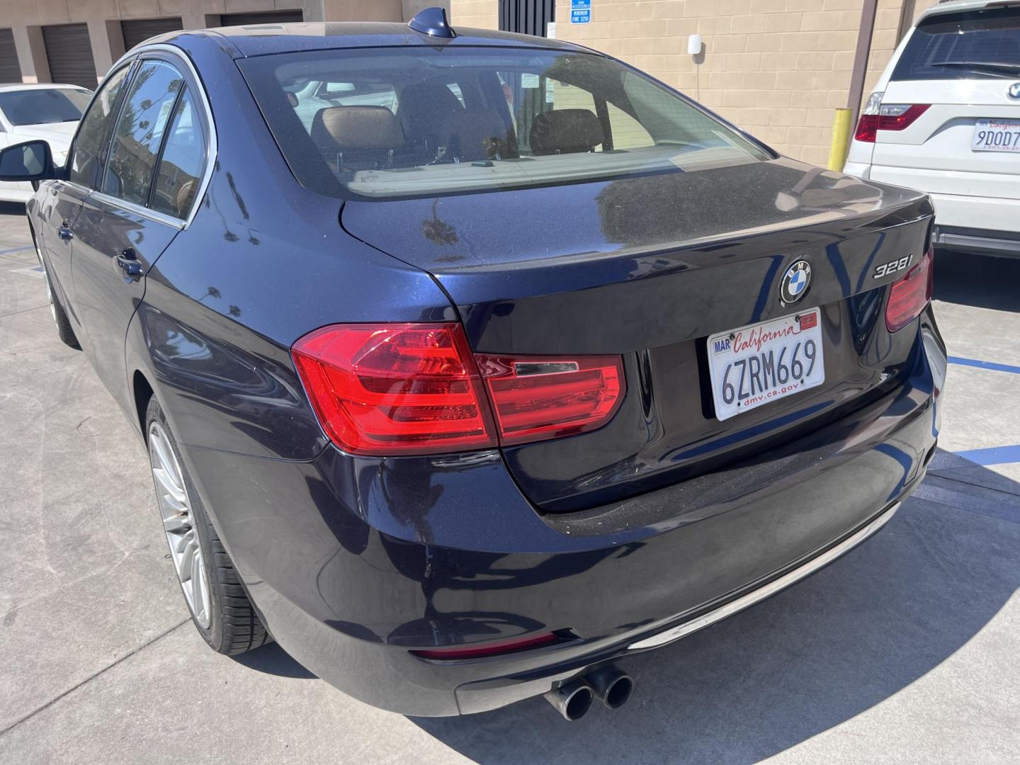 2013 Imperial Blue Metallic /Saddle Brown (Dakota Leather) BMW 3-Series 328i Sedan - SULEV (WBA3C1G51DN) with an 2.0L L4 DOHC 16V engine, Automatic transmission, located at 30 S. Berkeley Avenue, Pasadena, CA, 91107, (626) 248-7567, 34.145447, -118.109398 - 2013 BMW 3 Series Sedan – Buy Here Pay Here Pasadena, CA VIN: WBA3C1G51DNR44018 If you’re looking for a sporty, premium sedan that’s comfortable, efficient, and fun to drive, this 2013 BMW 3 Series is the sweet spot. Available now at Crown City Motors in Pasadena, CA, it delivers that cl - Photo#2