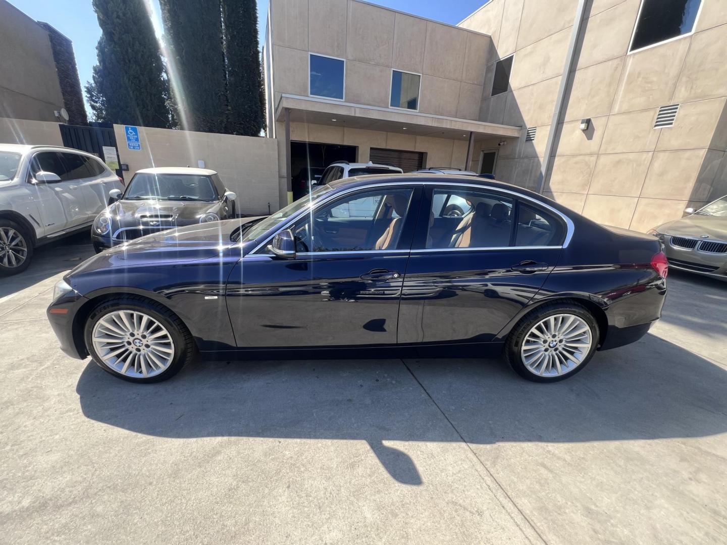 2013 Imperial Blue Metallic /Saddle Brown (Dakota Leather) BMW 3-Series 328i Sedan - SULEV (WBA3C1G51DN) with an 2.0L L4 DOHC 16V engine, Automatic transmission, located at 30 S. Berkeley Avenue, Pasadena, CA, 91107, (626) 248-7567, 34.145447, -118.109398 - 2013 BMW 3 Series Sedan – Buy Here Pay Here Pasadena, CA VIN: WBA3C1G51DNR44018 If you’re looking for a sporty, premium sedan that’s comfortable, efficient, and fun to drive, this 2013 BMW 3 Series is the sweet spot. Available now at Crown City Motors in Pasadena, CA, it delivers that cl - Photo#5