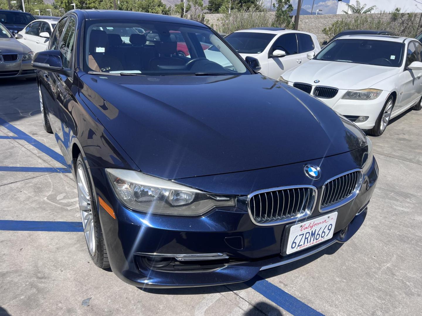 2013 Imperial Blue Metallic /Saddle Brown (Dakota Leather) BMW 3-Series 328i Sedan - SULEV (WBA3C1G51DN) with an 2.0L L4 DOHC 16V engine, Automatic transmission, located at 30 S. Berkeley Avenue, Pasadena, CA, 91107, (626) 248-7567, 34.145447, -118.109398 - 2013 BMW 3 Series Sedan – Buy Here Pay Here Pasadena, CA VIN: WBA3C1G51DNR44018 If you’re looking for a sporty, premium sedan that’s comfortable, efficient, and fun to drive, this 2013 BMW 3 Series is the sweet spot. Available now at Crown City Motors in Pasadena, CA, it delivers that cl - Photo#7