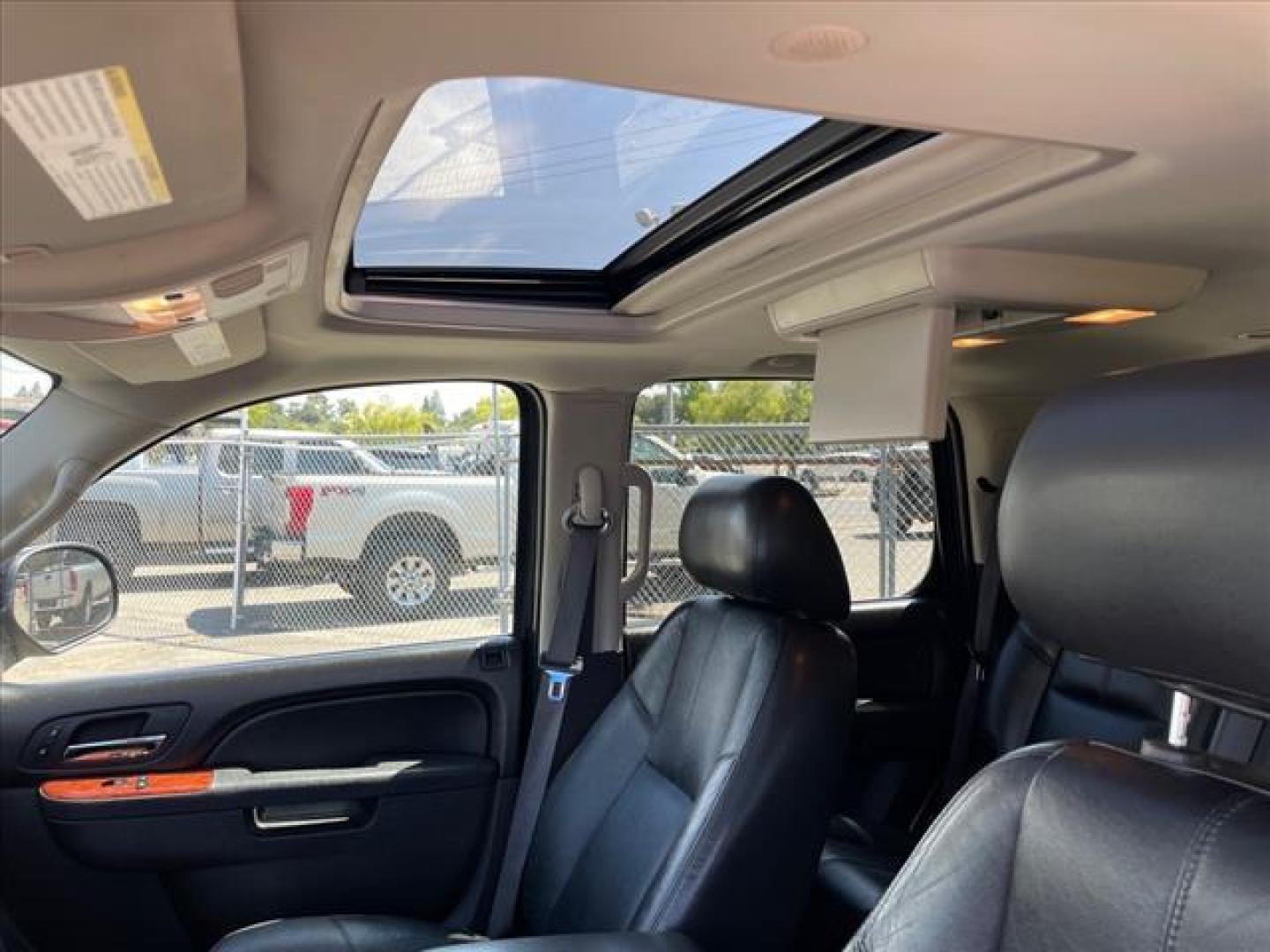 2013 Black Chevrolet Tahoe LT (1GNSKBE04DR) with an 5.3L Vortec Iron Block 5.3L Fl Other engine, 6-Speed Shiftable Automatic transmission, located at 800 Riverside Ave, Roseville, CA, 95678, 916-773-4549 & Toll Free: 866-719-4393, 38.732265, -121.291039 - 4X4 LT CUSTOM WHEELS DVD MOON ROOF LEATHER - Photo#11