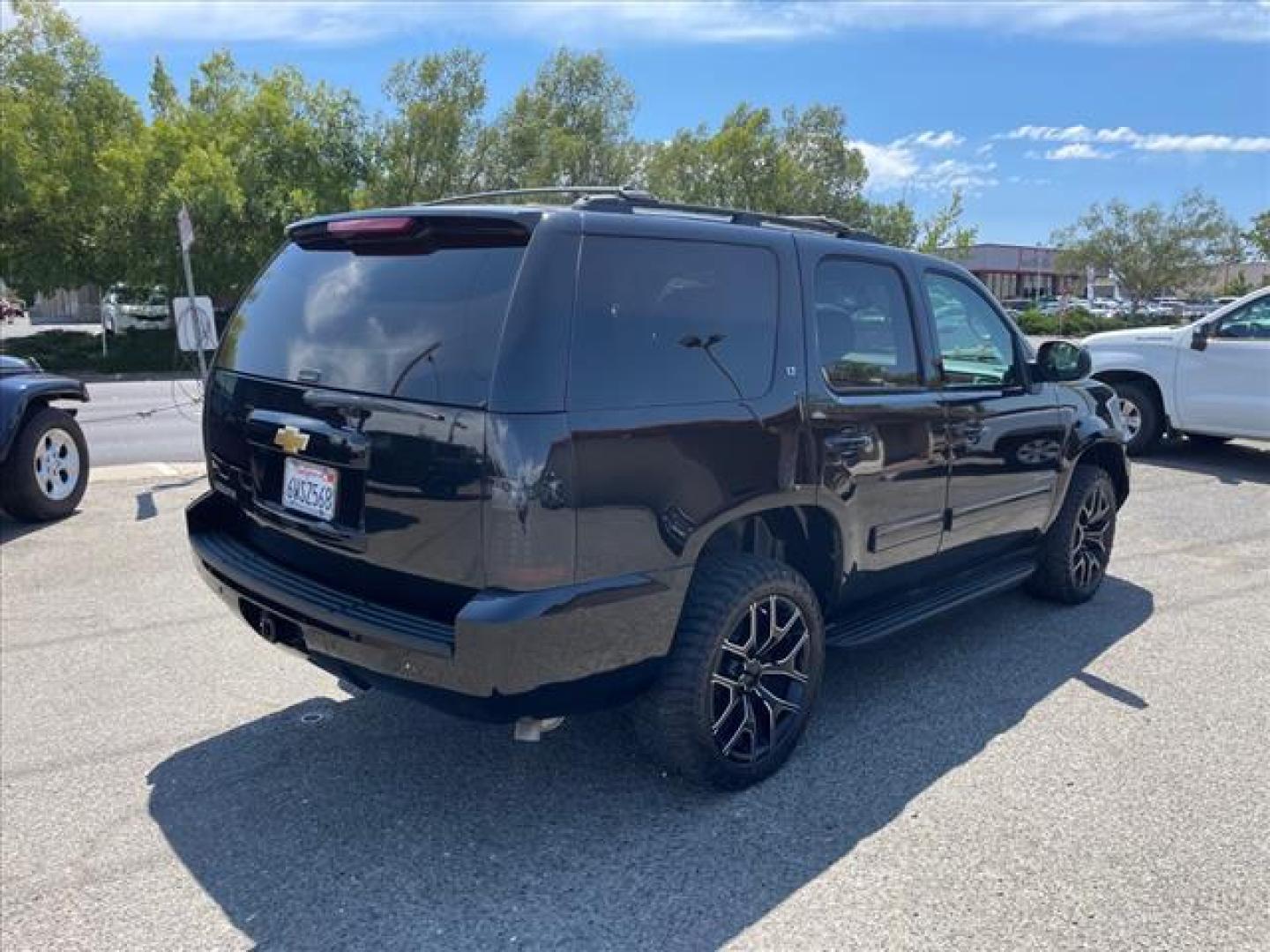 2013 Black Chevrolet Tahoe LT (1GNSKBE04DR) with an 5.3L Vortec Iron Block 5.3L Fl Other engine, 6-Speed Shiftable Automatic transmission, located at 800 Riverside Ave, Roseville, CA, 95678, 916-773-4549 & Toll Free: 866-719-4393, 38.732265, -121.291039 - 4X4 LT CUSTOM WHEELS DVD MOON ROOF LEATHER - Photo#3