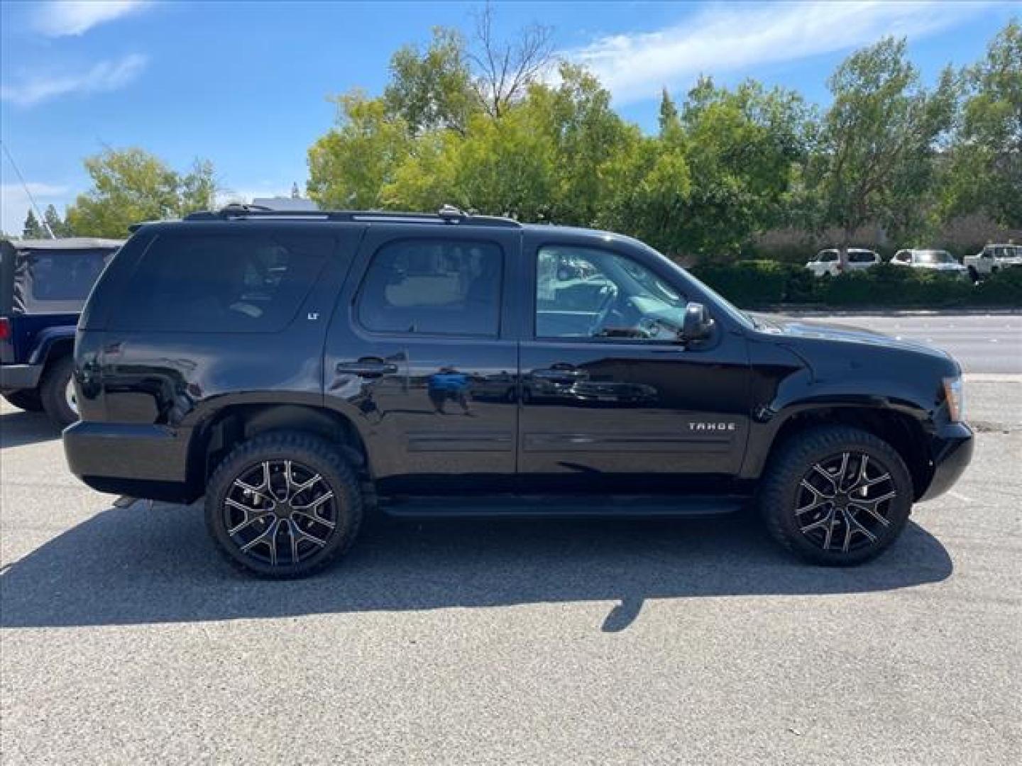 2013 Black Chevrolet Tahoe LT (1GNSKBE04DR) with an 5.3L Vortec Iron Block 5.3L Fl Other engine, 6-Speed Shiftable Automatic transmission, located at 800 Riverside Ave, Roseville, CA, 95678, 916-773-4549 & Toll Free: 866-719-4393, 38.732265, -121.291039 - 4X4 LT CUSTOM WHEELS DVD MOON ROOF LEATHER - Photo#5