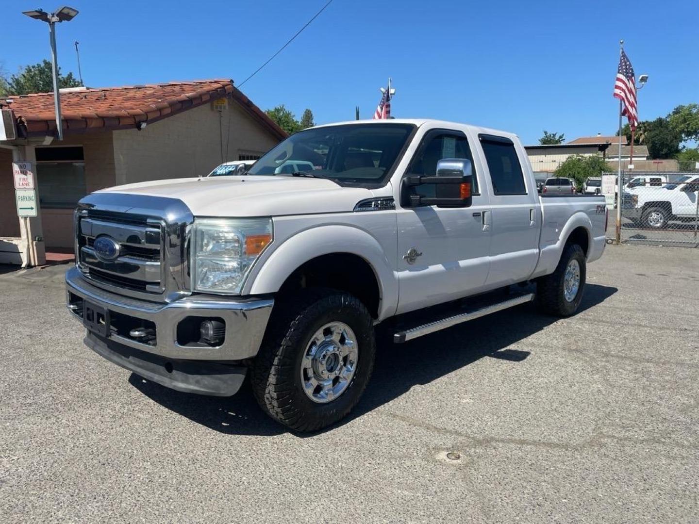 2013 Oxford White Ford F-250 Super Duty Lariat (1FT7W2BT4DE) with an 6.7L Power Stroke 6.7L Biodiesel Turbo V8 400hp 800ft. lbs. Common Rail Direct Injection engine, 6-Speed Shiftable Automatic transmission, located at 800 Riverside Ave, Roseville, CA, 95678, 916-773-4549 & Toll Free: 866-719-4393, 38.732265, -121.291039 - DIESEL CREW CAB 4X4 FX4 LARIAT MOON ROOF SERVICE RECORDS - Photo#0