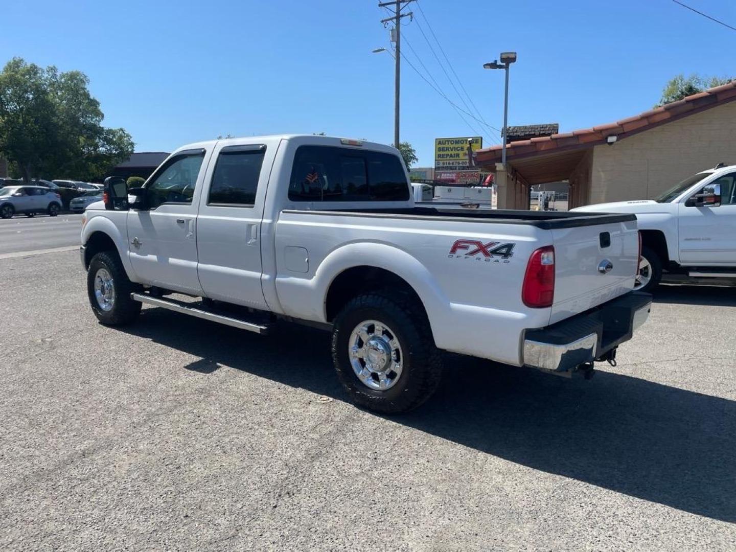 2013 Oxford White Ford F-250 Super Duty Lariat (1FT7W2BT4DE) with an 6.7L Power Stroke 6.7L Biodiesel Turbo V8 400hp 800ft. lbs. Common Rail Direct Injection engine, 6-Speed Shiftable Automatic transmission, located at 800 Riverside Ave, Roseville, CA, 95678, 916-773-4549 & Toll Free: 866-719-4393, 38.732265, -121.291039 - DIESEL CREW CAB 4X4 FX4 LARIAT MOON ROOF SERVICE RECORDS - Photo#2