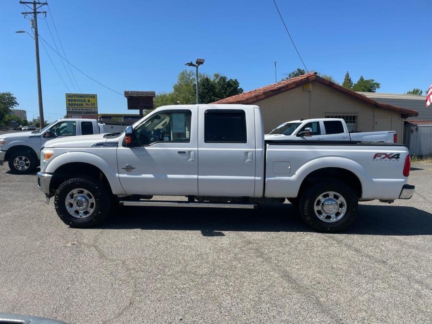 2013 Oxford White Ford F-250 Super Duty Lariat (1FT7W2BT4DE) with an 6.7L Power Stroke 6.7L Biodiesel Turbo V8 400hp 800ft. lbs. Common Rail Direct Injection engine, 6-Speed Shiftable Automatic transmission, located at 800 Riverside Ave, Roseville, CA, 95678, 916-773-4549 & Toll Free: 866-719-4393, 38.732265, -121.291039 - DIESEL CREW CAB 4X4 FX4 LARIAT MOON ROOF SERVICE RECORDS - Photo#4