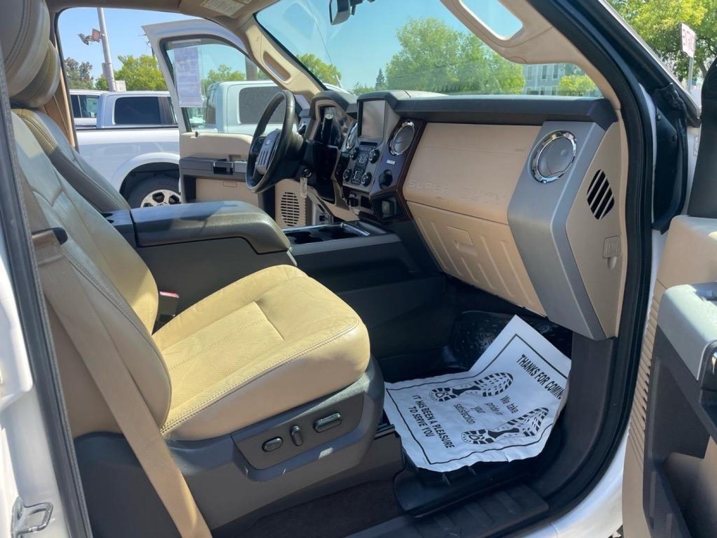 2013 Oxford White Ford F-250 Super Duty Lariat (1FT7W2BT4DE) with an 6.7L Power Stroke 6.7L Biodiesel Turbo V8 400hp 800ft. lbs. Common Rail Direct Injection engine, 6-Speed Shiftable Automatic transmission, located at 800 Riverside Ave, Roseville, CA, 95678, 916-773-4549 & Toll Free: 866-719-4393, 38.732265, -121.291039 - DIESEL CREW CAB 4X4 FX4 LARIAT MOON ROOF SERVICE RECORDS - Photo#12