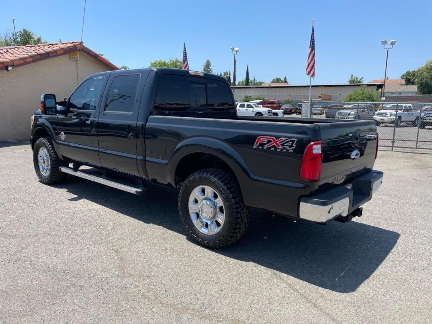 2013 Tuxedo Black Metallic Ford F-250 Super Duty Lariat (1FT7W2BT4DE) with an 6.7L Power Stroke 6.7L Biodiesel Turbo V8 400hp 800ft. lbs. Common Rail Direct Injection engine, 6-Speed Shiftable Automatic transmission, located at 800 Riverside Ave, Roseville, CA, 95678, 916-773-4549 & Toll Free: 866-719-4393, 38.732265, -121.291039 - DIESEL CREW CAB 4X4 FX4 LARIAT SERVICE RECORDS NEW TIRES - Photo#2