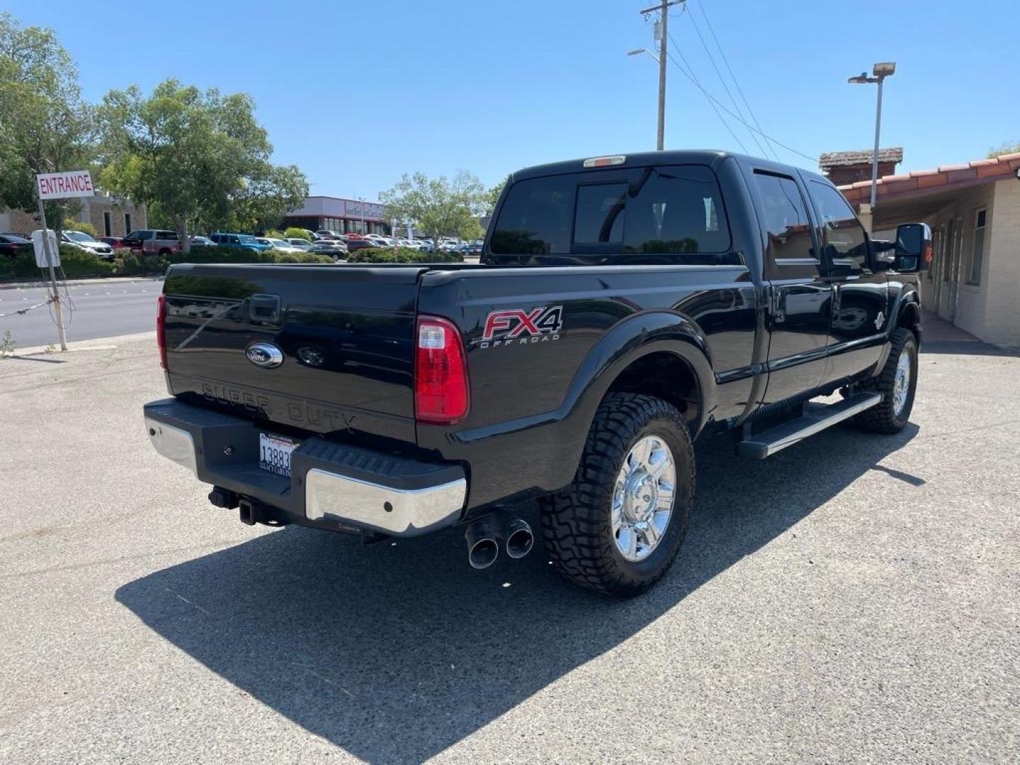 2013 Tuxedo Black Metallic Ford F-250 Super Duty Lariat (1FT7W2BT4DE) with an 6.7L Power Stroke 6.7L Biodiesel Turbo V8 400hp 800ft. lbs. Common Rail Direct Injection engine, 6-Speed Shiftable Automatic transmission, located at 800 Riverside Ave, Roseville, CA, 95678, 916-773-4549 & Toll Free: 866-719-4393, 38.732265, -121.291039 - DIESEL CREW CAB 4X4 FX4 LARIAT SERVICE RECORDS NEW TIRES - Photo#3