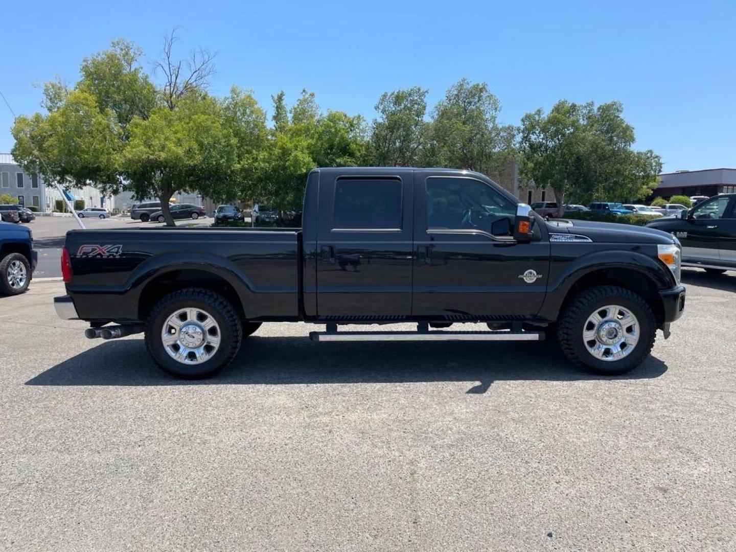 2013 Tuxedo Black Metallic Ford F-250 Super Duty Lariat (1FT7W2BT4DE) with an 6.7L Power Stroke 6.7L Biodiesel Turbo V8 400hp 800ft. lbs. Common Rail Direct Injection engine, 6-Speed Shiftable Automatic transmission, located at 800 Riverside Ave, Roseville, CA, 95678, 916-773-4549 & Toll Free: 866-719-4393, 38.732265, -121.291039 - DIESEL CREW CAB 4X4 FX4 LARIAT SERVICE RECORDS NEW TIRES - Photo#5