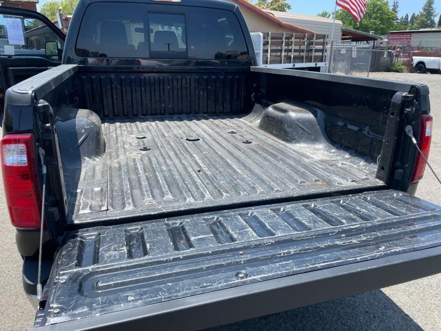 2013 Tuxedo Black Metallic Ford F-250 Super Duty Lariat (1FT7W2BT4DE) with an 6.7L Power Stroke 6.7L Biodiesel Turbo V8 400hp 800ft. lbs. Common Rail Direct Injection engine, 6-Speed Shiftable Automatic transmission, located at 800 Riverside Ave, Roseville, CA, 95678, 916-773-4549 & Toll Free: 866-719-4393, 38.732265, -121.291039 - DIESEL CREW CAB 4X4 FX4 LARIAT SERVICE RECORDS NEW TIRES - Photo#9