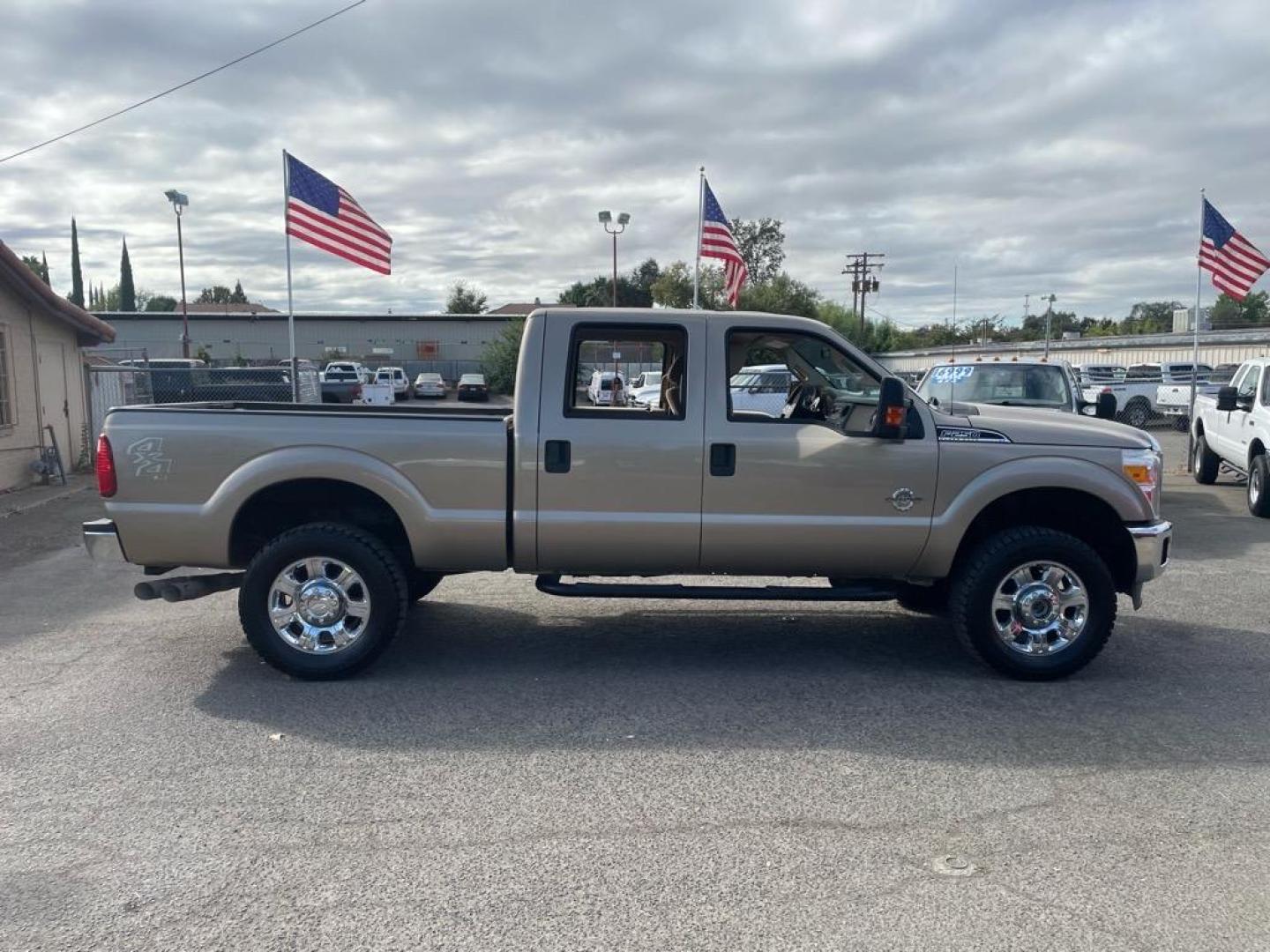 2013 Pale Adobe Metallic Ford F-250 Super Duty XLT (1FT7W2BT1DE) with an 6.7L Power Stroke 6.7L Biodiesel Turbo V8 400hp 800ft. lbs. Common Rail Direct Injection engine, 6-Speed Shiftable Automatic transmission, located at 800 Riverside Ave, Roseville, CA, 95678, 916-773-4549 & Toll Free: 866-719-4393, 38.732265, -121.291039 - DIESEL CREW CAB 4X4 XLT NEW TIRES CLEAN CARFAX - Photo#3