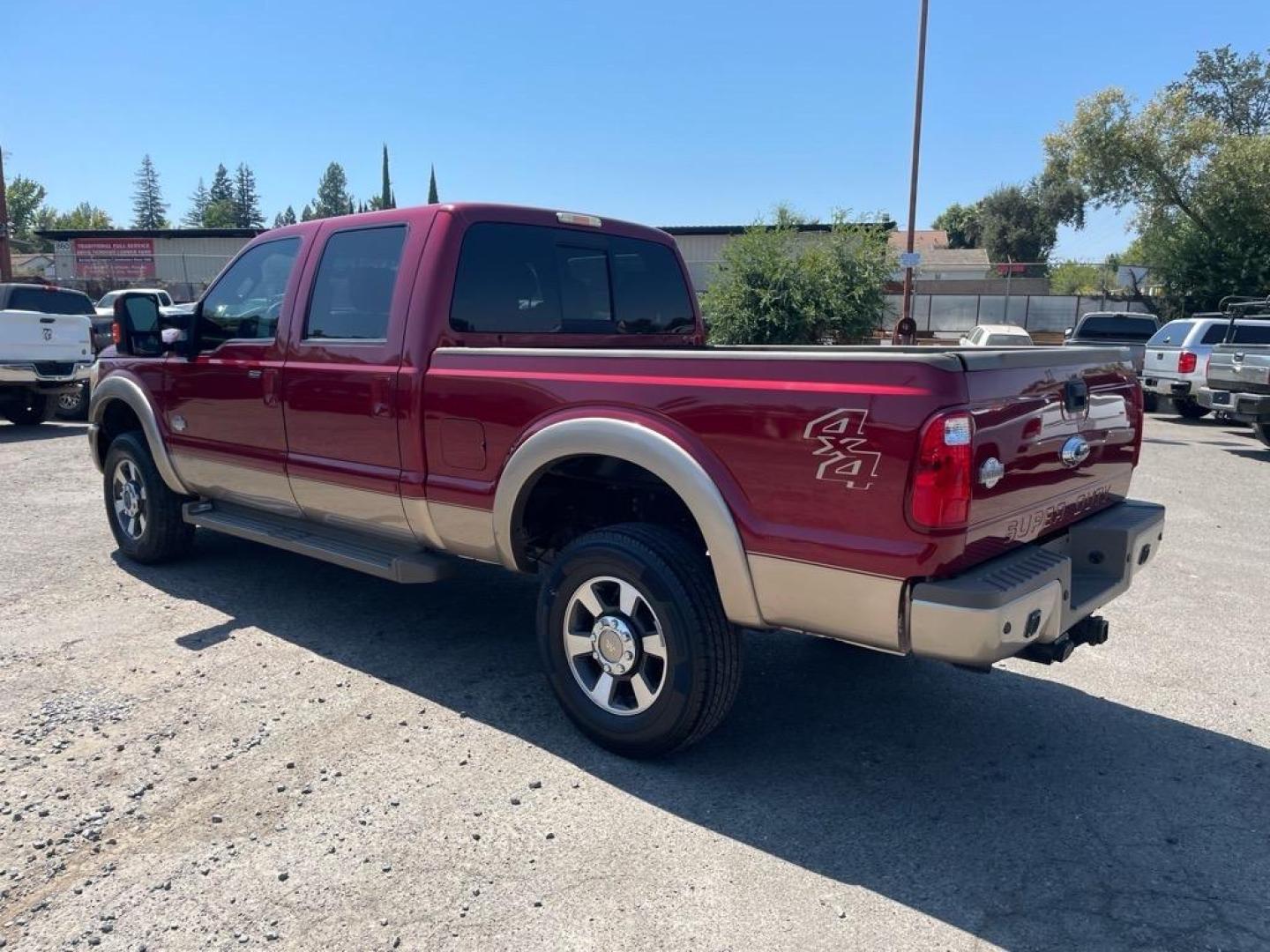 2013 Autumn Red Metallic/Pale Adobe Metallic Ford F-350 Super Duty King Ranch (1FT8W3BT3DE) with an 6.7L Power Stroke 6.7L Biodiesel Turbo V8 400hp 800ft. lbs. Common Rail Direct Injection engine, 6-Speed Shiftable Automatic transmission, located at 800 Riverside Ave, Roseville, CA, 95678, 916-773-4549 & Toll Free: 866-719-4393, 38.732265, -121.291039 - DIESEL CREW CAB 4X4 KING RANCH SERVICE RECORDS - Photo#2
