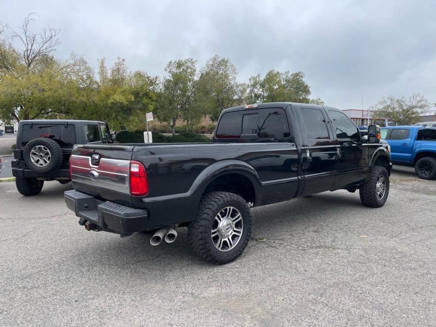 2013 Tuxedo Black Metallic Ford F-350 Super Duty Platinum (1FT8W3BT9DE) with an 6.7L Power Stroke 6.7L Biodiesel Turbo V8 400hp 800ft. lbs. Common Rail Direct Injection engine, 6-Speed Shiftable Automatic transmission, located at 800 Riverside Ave, Roseville, CA, 95678, 916-773-4549 & Toll Free: 866-719-4393, 38.732265, -121.291039 - Photo#3