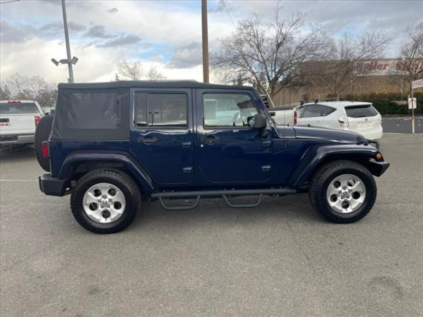 2013 True Blue Pearl Coat Jeep Wrangler Unlimited Sahara (1C4BJWEG7DL) with an 3.6L 3.6L V6 285hp 260ft. lbs. Sequential Multiport Fuel Injection engine, 5-Speed Automatic transmission, located at 800 Riverside Ave, Roseville, CA, 95678, 916-773-4549 & Toll Free: 866-719-4393, 38.732265, -121.291039 - 4X4 UMLIMITED SAHARA NEW SOFT TOP NEW TIRES - Photo#5