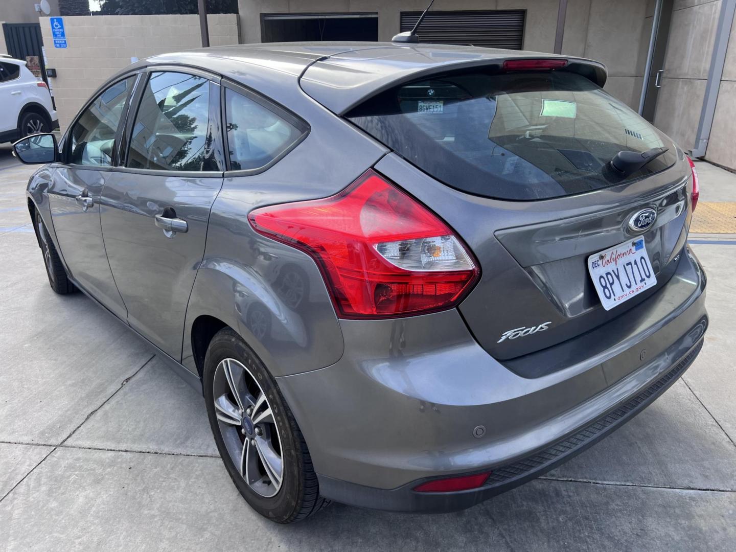 2014 Gray /Balck Ford Focus SE Hatch (1FADP3K21EL) with an 2.0L L4 DOHC 16V engine, Automatic transmission, located at 30 S. Berkeley Avenue, Pasadena, CA, 91107, (626) 248-7567, 34.145447, -118.109398 - Microsoft Sync! Moon-roof! This 2014 Ford Focus SE Hatch looks and drives good. Bad credit? We can help! We are the bank. - Photo#1