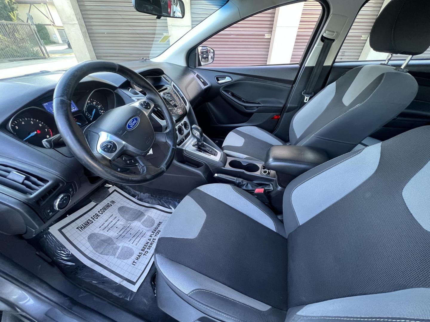2014 Gray /Balck Ford Focus SE Hatch (1FADP3K21EL) with an 2.0L L4 DOHC 16V engine, Automatic transmission, located at 30 S. Berkeley Avenue, Pasadena, CA, 91107, (626) 248-7567, 34.145447, -118.109398 - Microsoft Sync! Moon-roof! This 2014 Ford Focus SE Hatch looks and drives good. Bad credit? We can help! We are the bank. - Photo#19