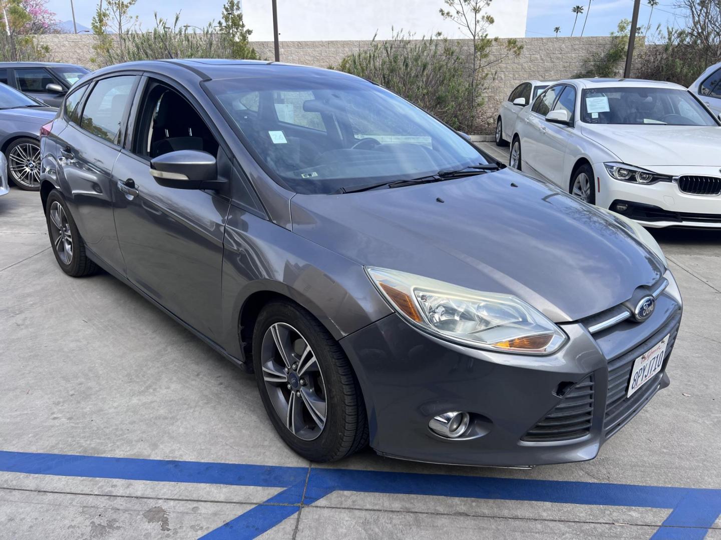 2014 Gray /Balck Ford Focus SE Hatch (1FADP3K21EL) with an 2.0L L4 DOHC 16V engine, Automatic transmission, located at 30 S. Berkeley Avenue, Pasadena, CA, 91107, (626) 248-7567, 34.145447, -118.109398 - Microsoft Sync! Moon-roof! This 2014 Ford Focus SE Hatch looks and drives good. Bad credit? We can help! We are the bank. - Photo#3