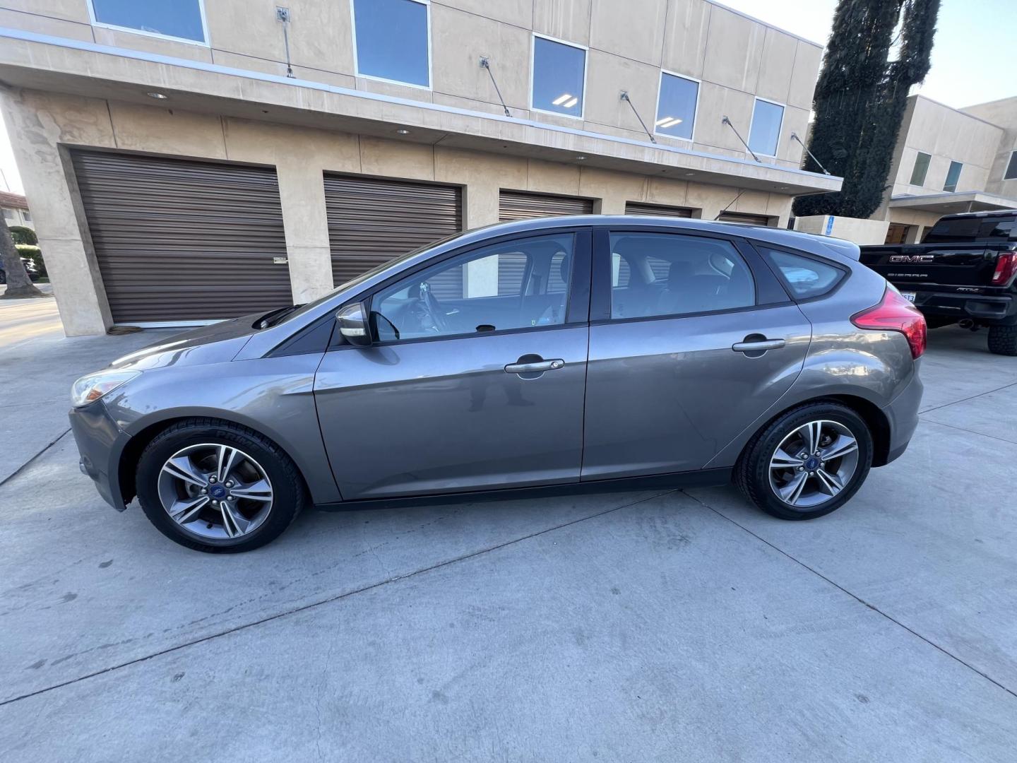 2014 Gray /Balck Ford Focus SE Hatch (1FADP3K21EL) with an 2.0L L4 DOHC 16V engine, Automatic transmission, located at 30 S. Berkeley Avenue, Pasadena, CA, 91107, (626) 248-7567, 34.145447, -118.109398 - Microsoft Sync! Moon-roof! This 2014 Ford Focus SE Hatch looks and drives good. Bad credit? We can help! We are the bank. - Photo#10
