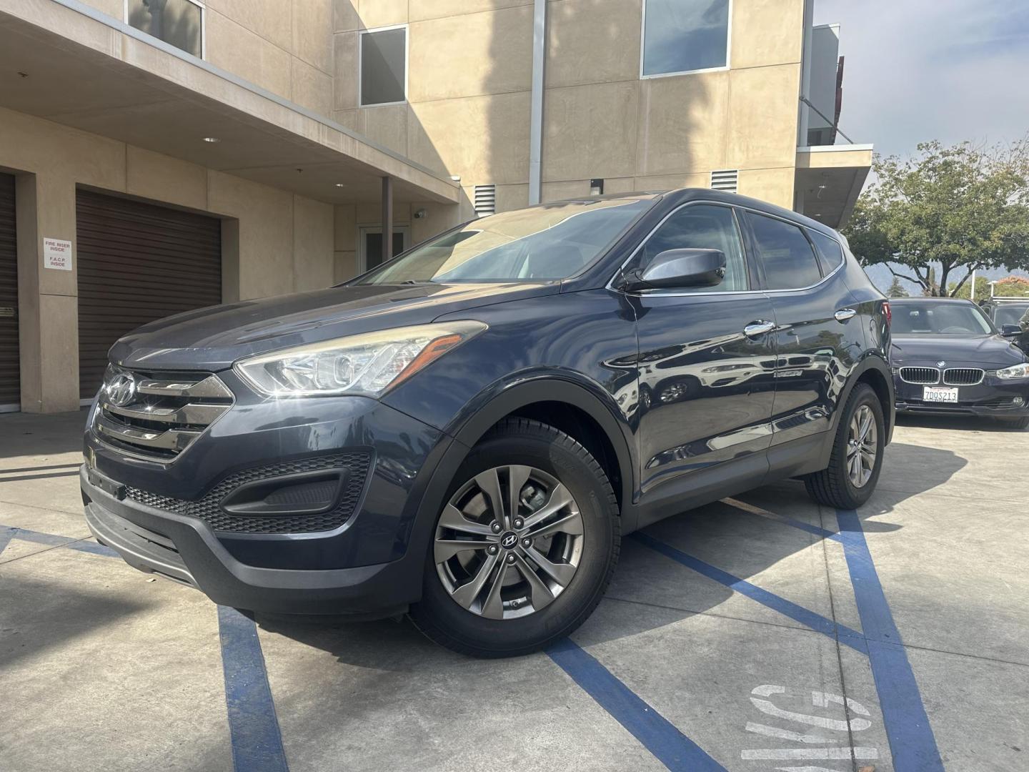 2014 Night Sky Pearl. /Gray Hyundai Santa Fe Sport 2.4 FWD (5XYZT3LB4EG) with an 2.4L L4 DOHC 16V engine, 6-Speed Automatic transmission, located at 30 S. Berkeley Avenue, Pasadena, CA, 91107, (626) 248-7567, 34.145447, -118.109398 - 2014 Hyundai Santa Fe Sport FWD 2.4: Versatility, Comfort, and Affordable Bad Credit Financing at Buy Here Pay Here Dealerships The 2014 Hyundai Santa Fe Sport FWD 2.4 is an exceptional midsize SUV that offers a balance of power, comfort, and affordability. It’s a top choice for families, daily - Photo#3
