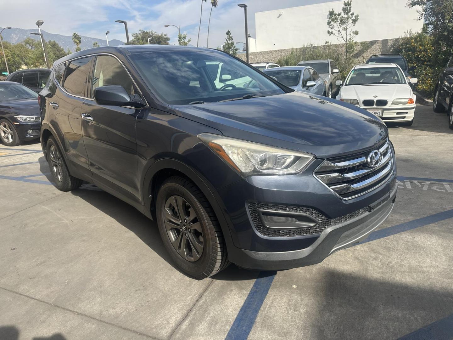 2014 Night Sky Pearl. /Gray Hyundai Santa Fe Sport 2.4 FWD (5XYZT3LB4EG) with an 2.4L L4 DOHC 16V engine, 6-Speed Automatic transmission, located at 30 S. Berkeley Avenue, Pasadena, CA, 91107, (626) 248-7567, 34.145447, -118.109398 - 2014 Hyundai Santa Fe Sport FWD 2.4: Versatility, Comfort, and Affordable Bad Credit Financing at Buy Here Pay Here Dealerships The 2014 Hyundai Santa Fe Sport FWD 2.4 is an exceptional midsize SUV that offers a balance of power, comfort, and affordability. It’s a top choice for families, daily - Photo#6