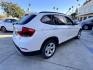 2014 White /beige BMW X1 sDrive28i (WBAVM1C50EV) with an 2.0L L4 DOHC 16V engine, 8-Speed Automatic transmission, located at 30 S. Berkeley Avenue, Pasadena, CA, 91107, (626) 248-7567, 34.145447, -118.109398 - Crown City Motors is a used “Buy Here Pay Here” car dealer in Pasadena CA. “Buy Here Pay Here” financing, means that when you purchase your vehicle from our dealership, that you make the payments to the dealership as well. We do not need the banks approval to get you approved for a used auto - Photo#7