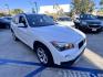2014 White /beige BMW X1 sDrive28i (WBAVM1C50EV) with an 2.0L L4 DOHC 16V engine, 8-Speed Automatic transmission, located at 30 S. Berkeley Avenue, Pasadena, CA, 91107, (626) 248-7567, 34.145447, -118.109398 - Crown City Motors is a used “Buy Here Pay Here” car dealer in Pasadena CA. “Buy Here Pay Here” financing, means that when you purchase your vehicle from our dealership, that you make the payments to the dealership as well. We do not need the banks approval to get you approved for a used auto - Photo#11