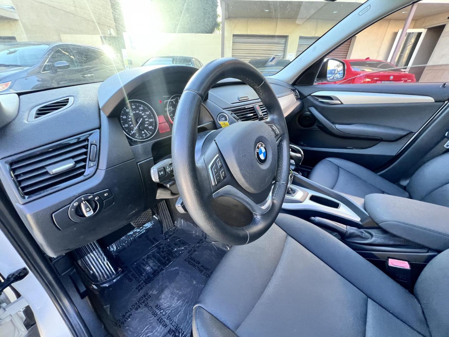 2014 White /beige BMW X1 sDrive28i (WBAVM1C50EV) with an 2.0L L4 DOHC 16V engine, 8-Speed Automatic transmission, located at 30 S. Berkeley Avenue, Pasadena, CA, 91107, (626) 248-7567, 34.145447, -118.109398 - Crown City Motors is a used “Buy Here Pay Here” car dealer in Pasadena CA. “Buy Here Pay Here” financing, means that when you purchase your vehicle from our dealership, that you make the payments to the dealership as well. We do not need the banks approval to get you approved for a used auto - Photo#14